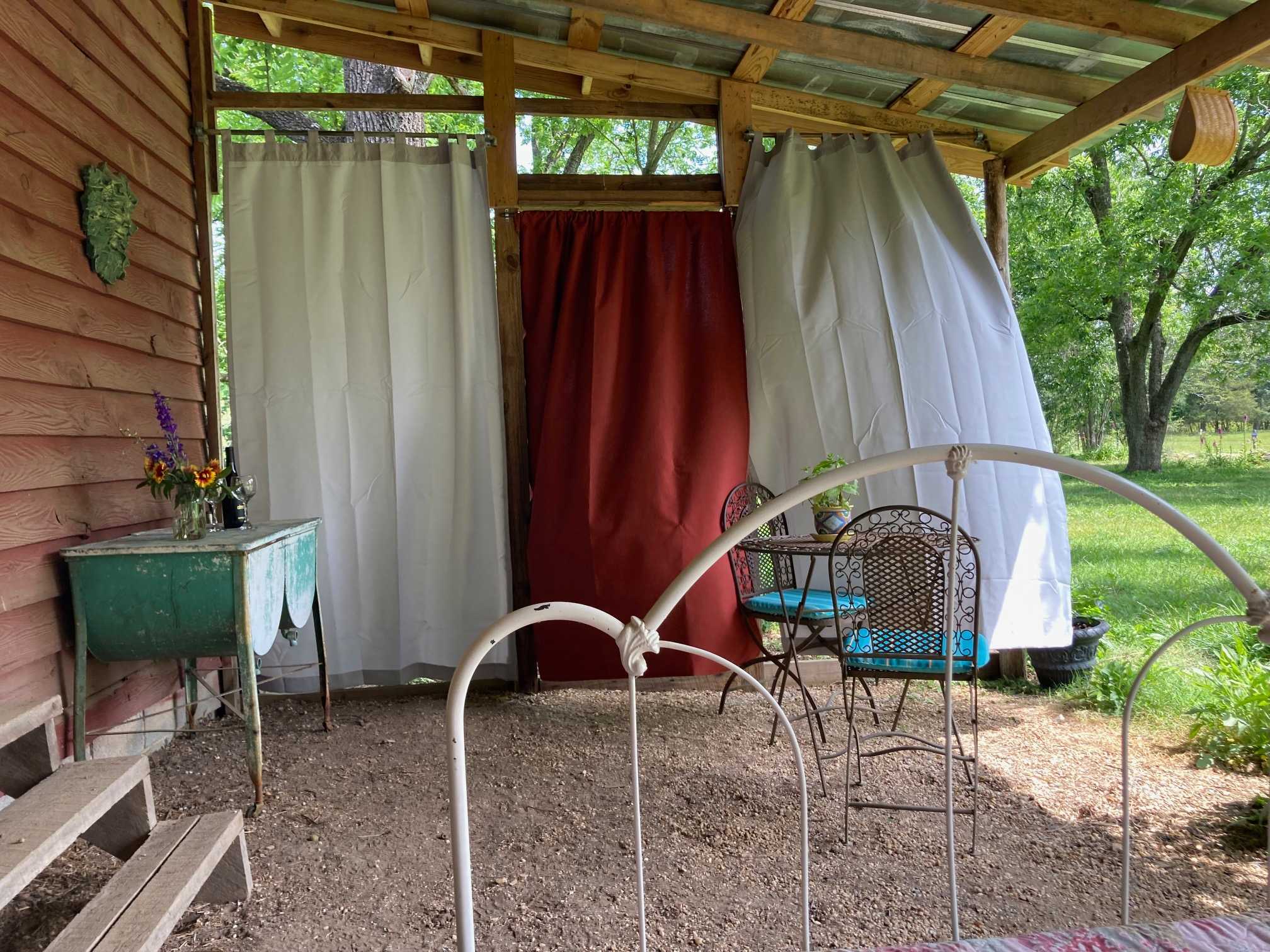 Curtains provide privacy from the farmhouse