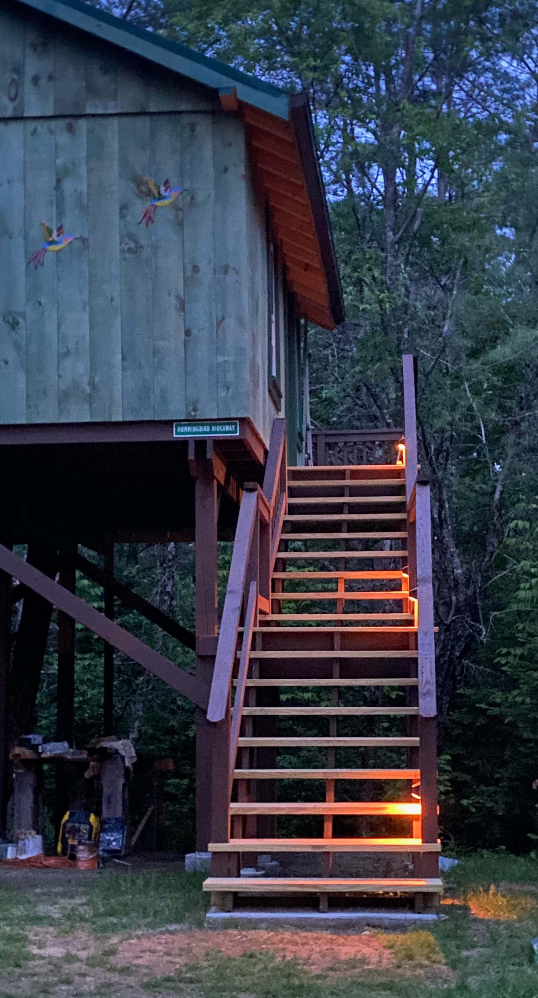 Solar lights light up the stairs at night.