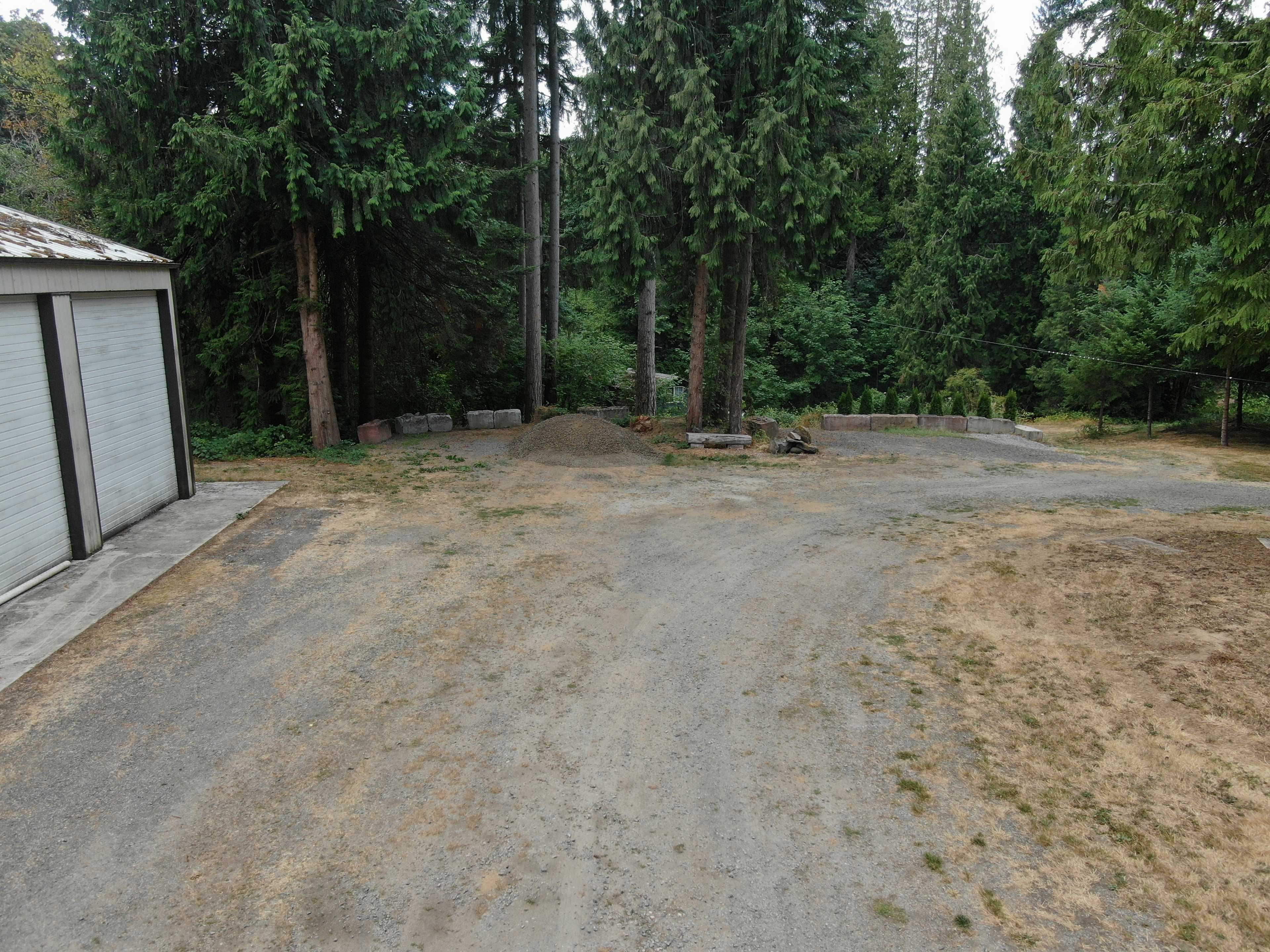 2 parking areas are available for dispersed campers on the property. You can park in either of the concrete block areas.  There is a 30 amp RV plug behid the shop area . You can back into the spot begind the building, to the left. Please try not to block the other parking areas. 

If you need help backing in, feel free to ask for help. Stu or Anita can get you where you want to go.