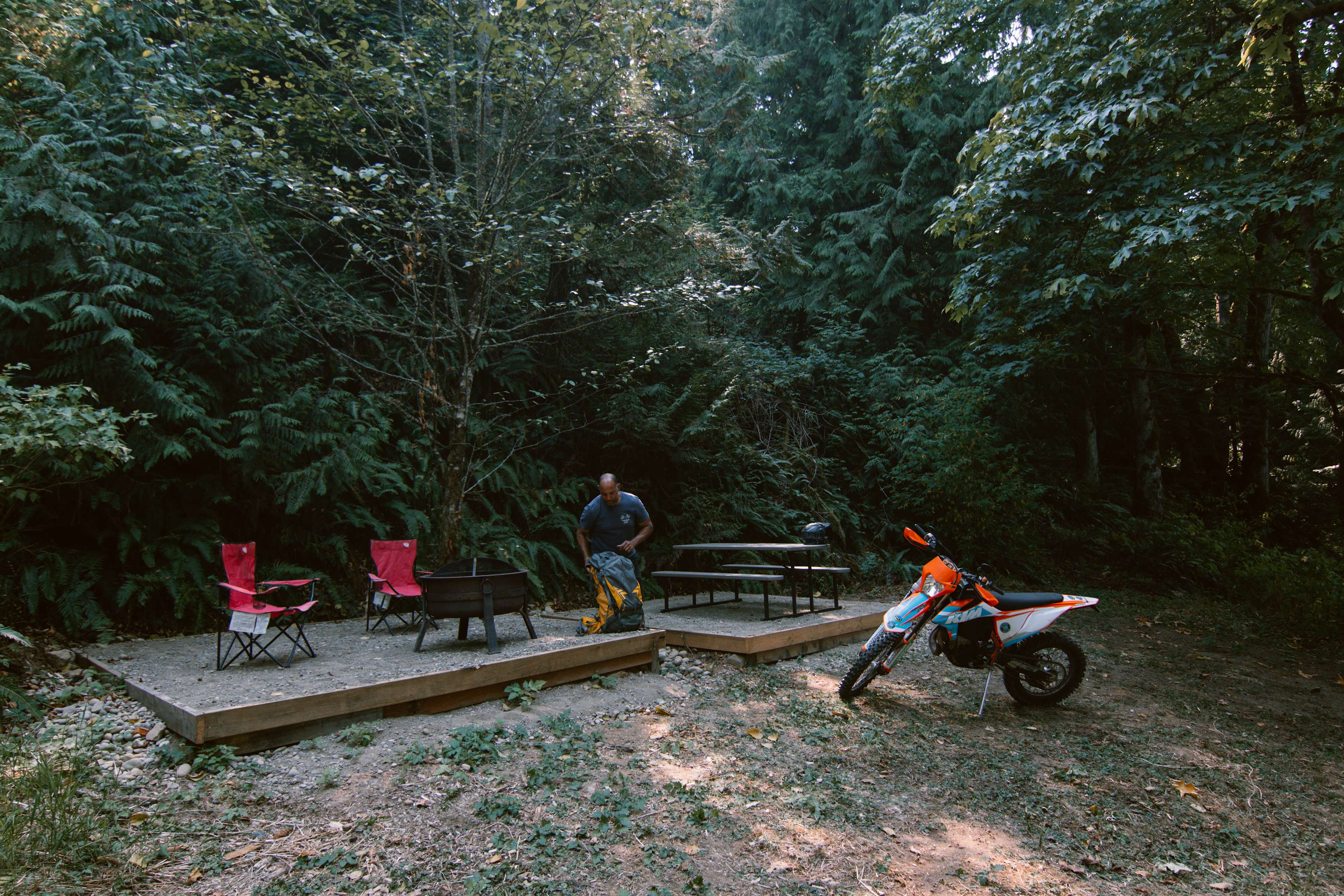 Site 3: Camp site for tents. Here is Shaums our host setting up with his bike. 