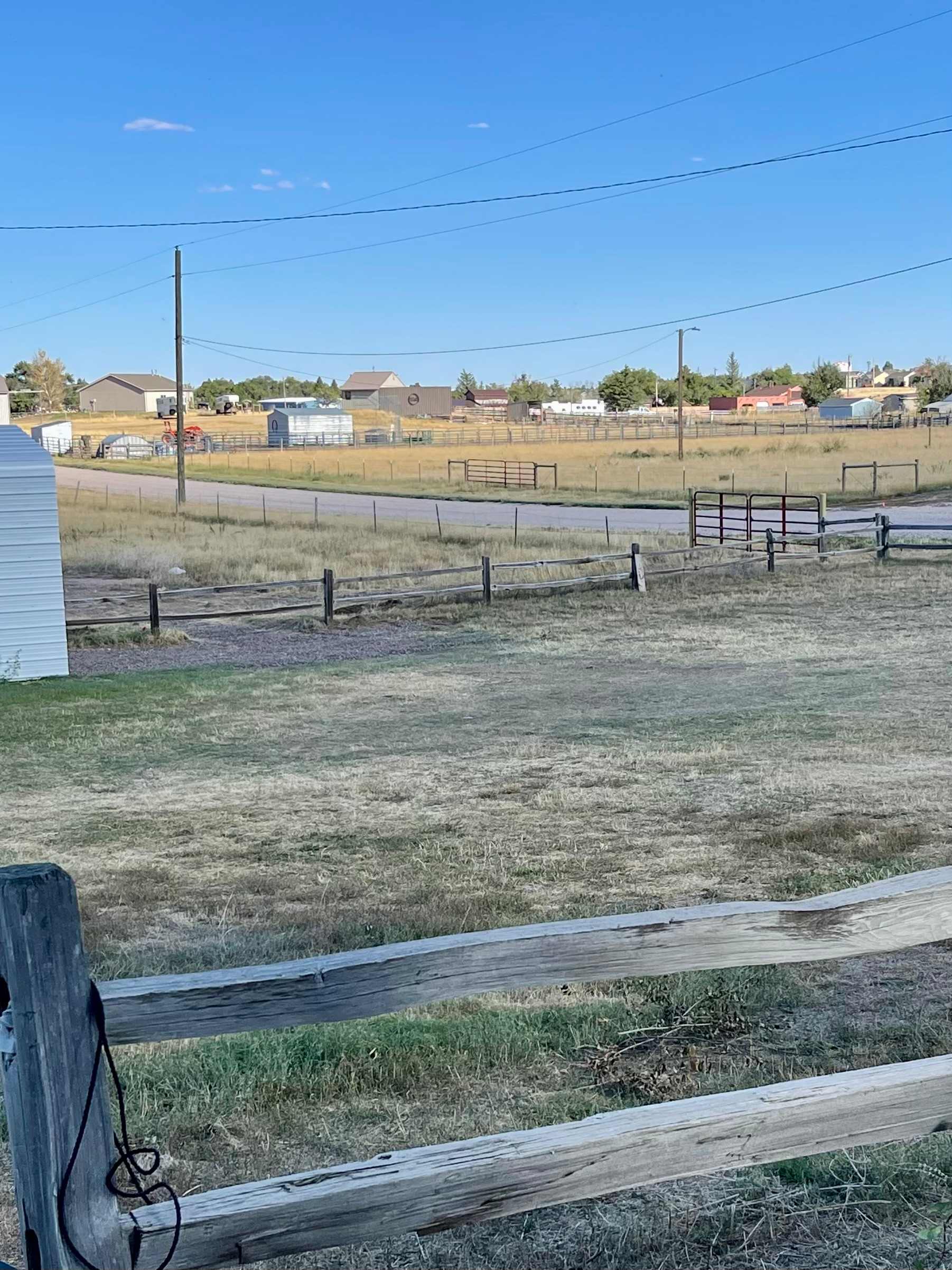 View from back yard off house & patio looking at gate entrance