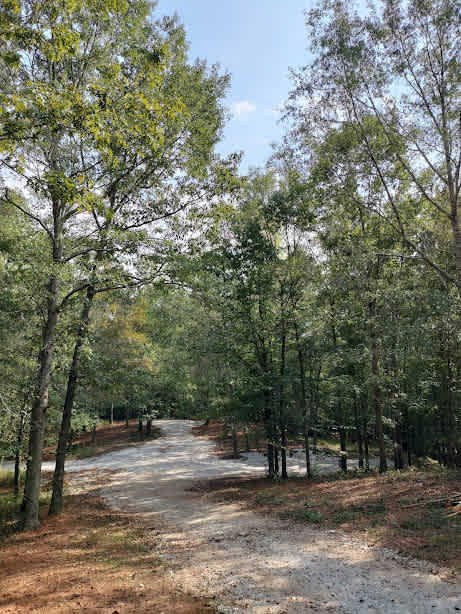 Looking into the Hairy Hiker Woods RV sites. Hide & Seek Dr. is the 1st site on the right.