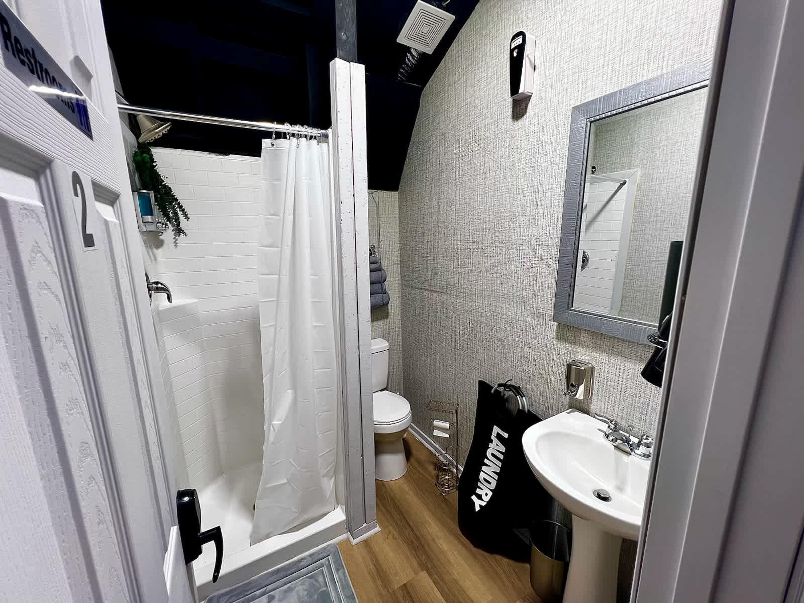 Complete bathroom setup with showers