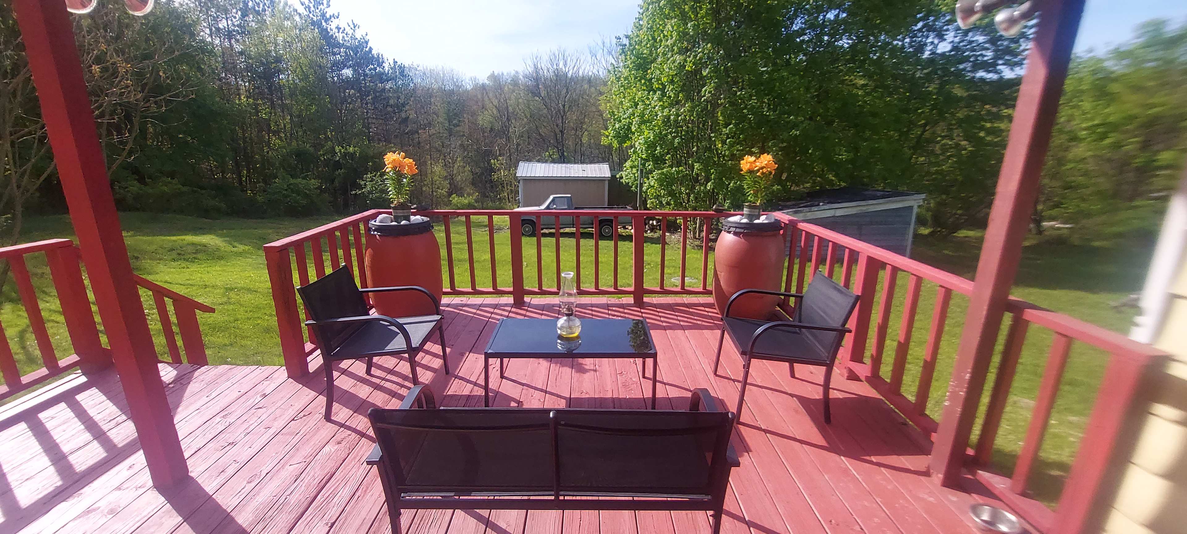 This deck goes out to the back yard. You can camp on the lawn behind the deck 