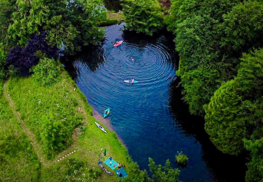 Spring-fed swimming pond. A stroll from the tents, past the outdoor spa you will find two beautiful spring-fed ponds, one for leisure, one for wildlife. The water is tested regularly and deemed "excellent for swimming" 