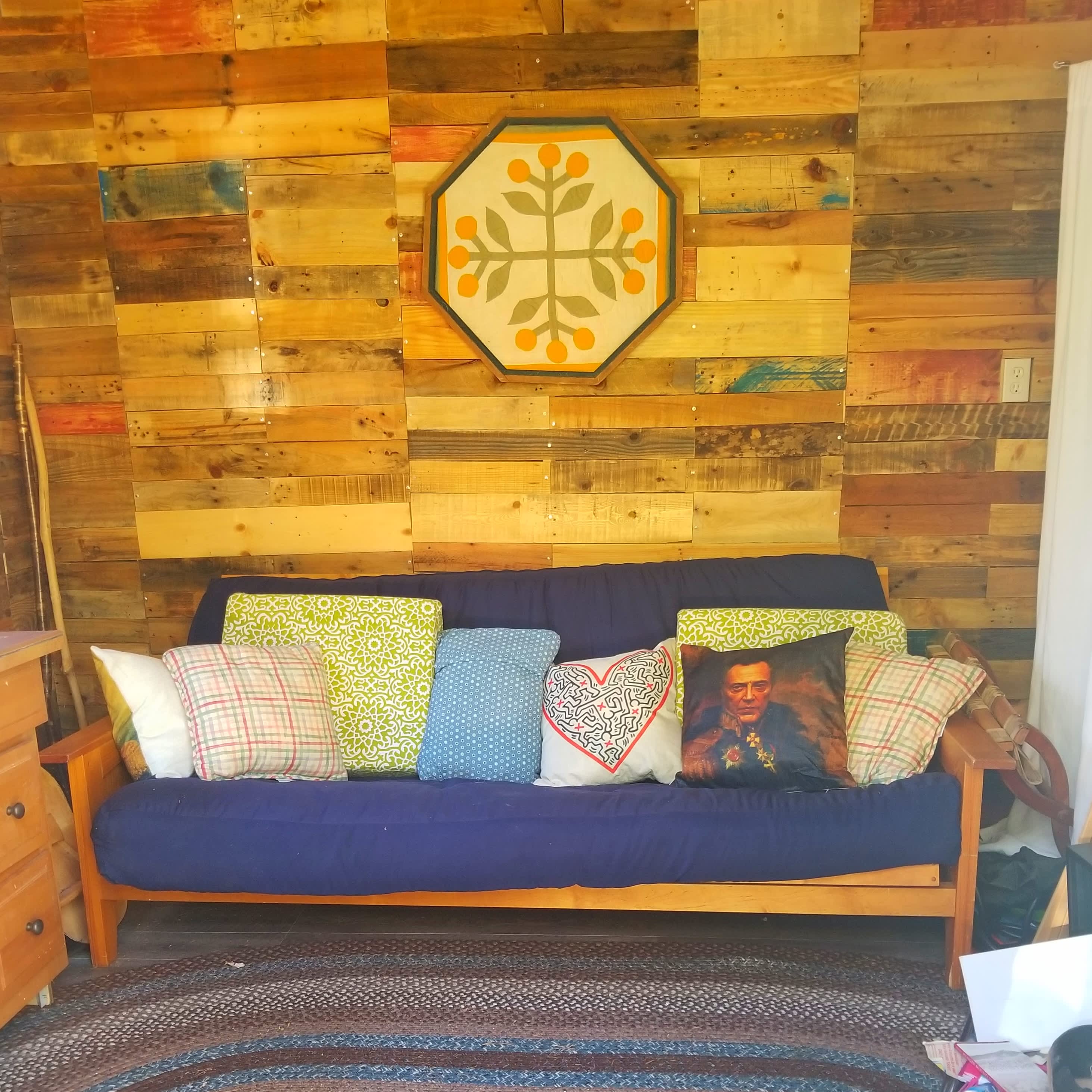 Futon sofa opens to  a full sized bed.