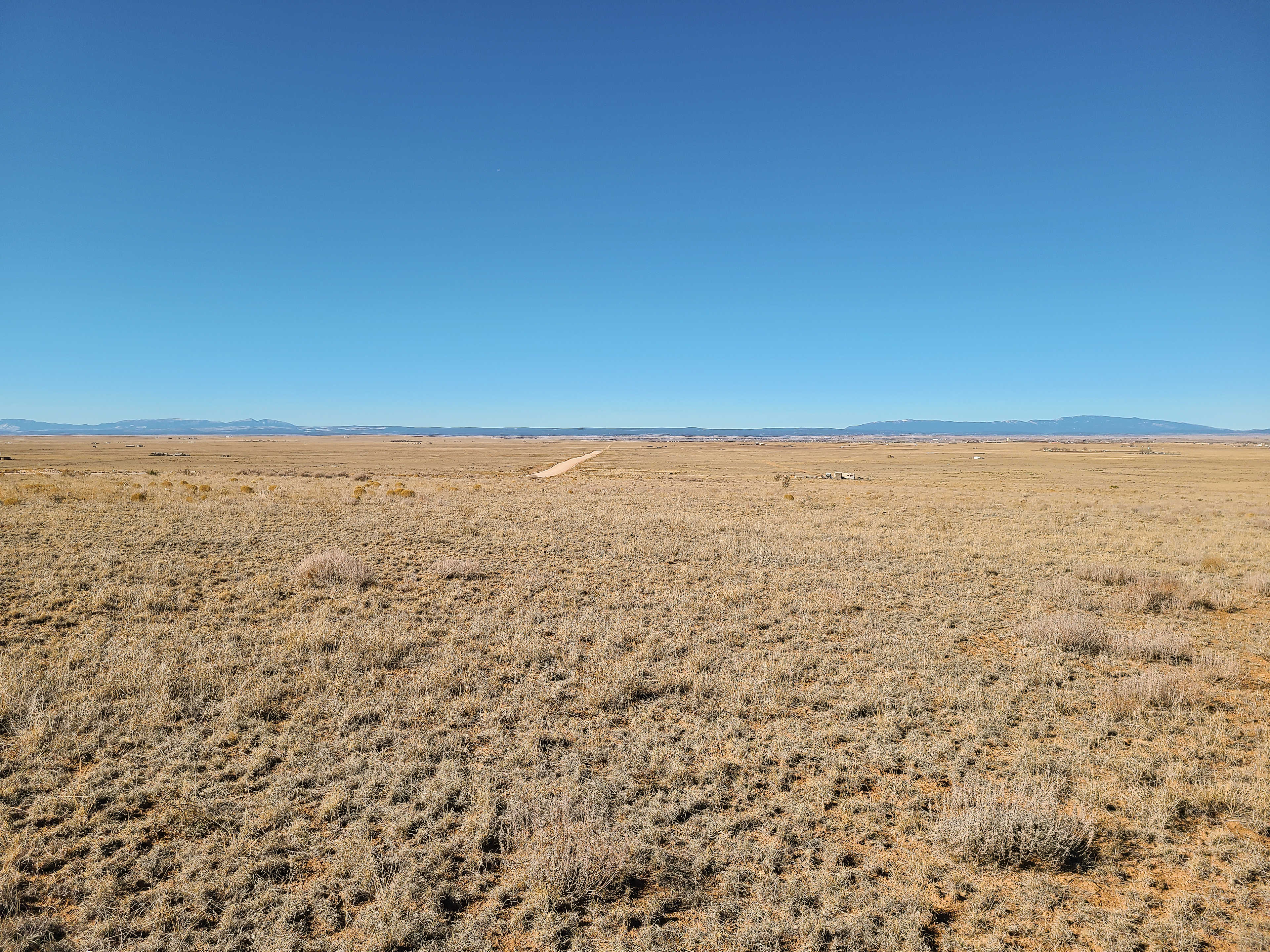 Well-maintained and wide county road in,  located just off I-40 and historic Route 66.