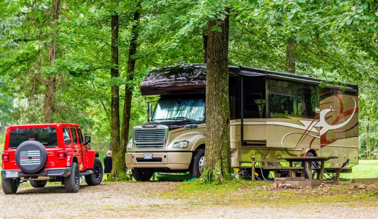 Not a site-specific photo. It is from our campground. We are working on getting site photos, but this is representative of all the sites. Shaded, picnic table, grill, firepit.