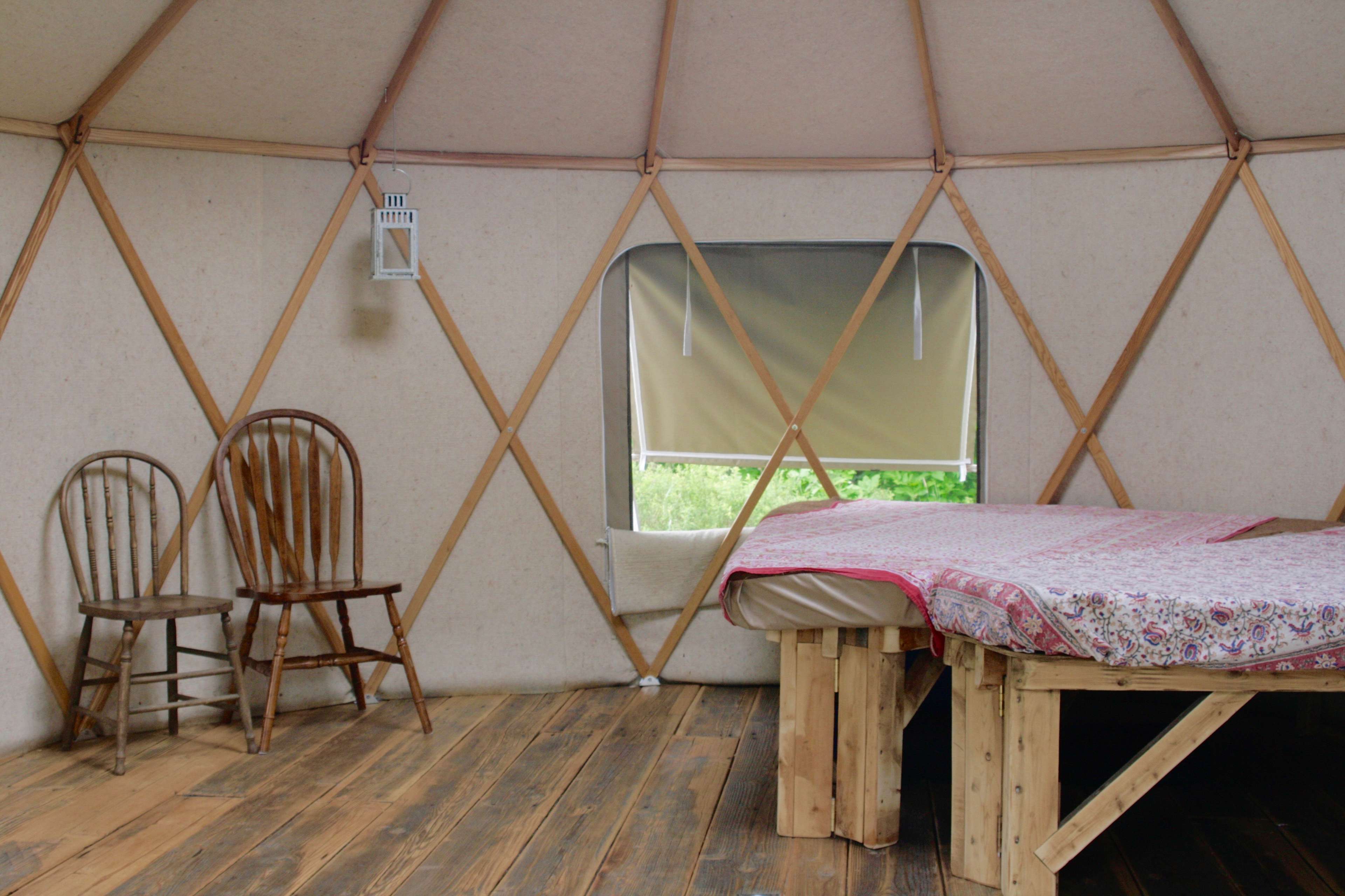 Interior includes 2 custom raised beds with mattresses, fit 2-4 people, extra cot is available if needed.  Please bring your own sleeping bags.