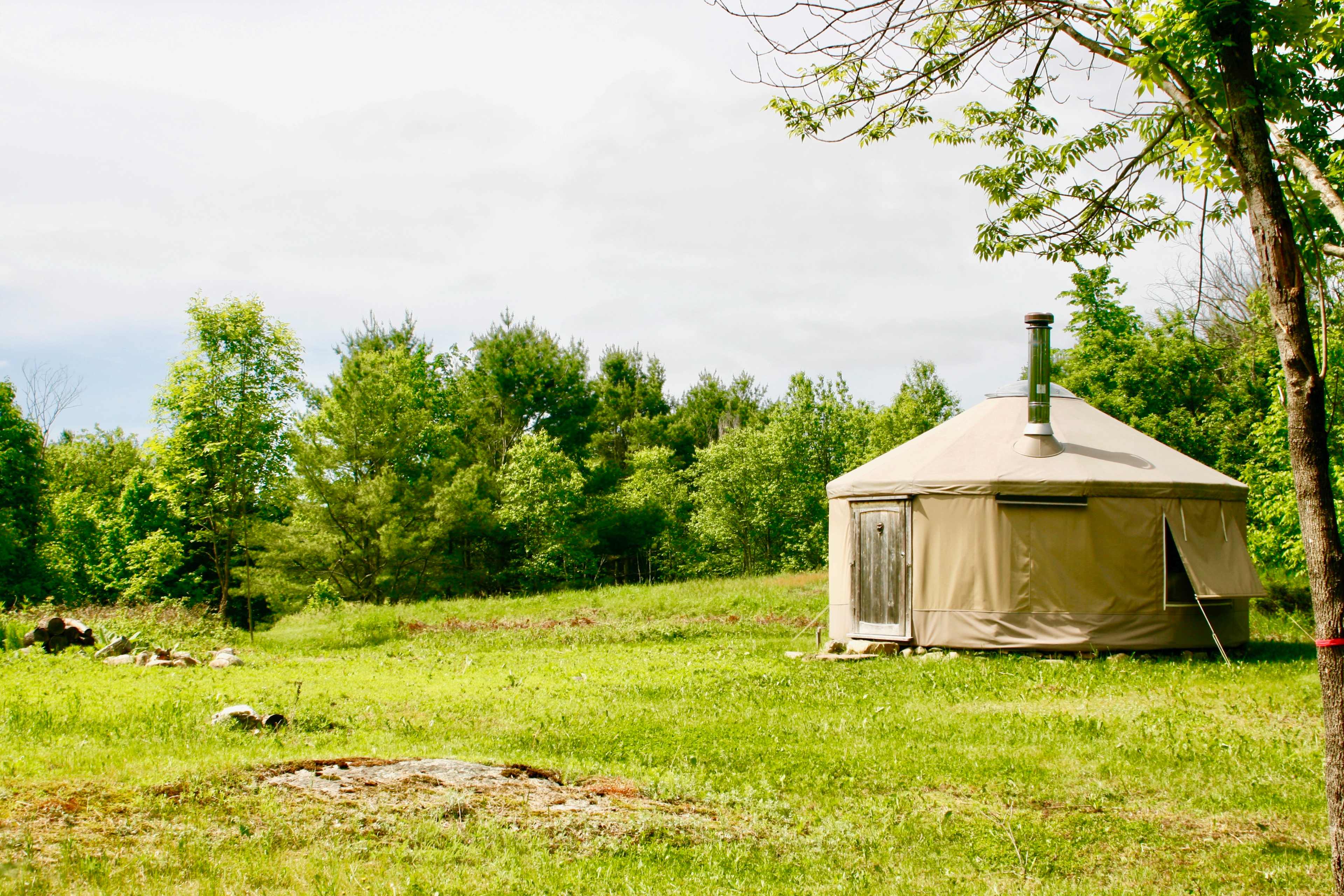 The 4 seasons Yurta sits in the middle of our property atop an elevated area surrounded by forest, small meadow, rolling hills, well maintained trails