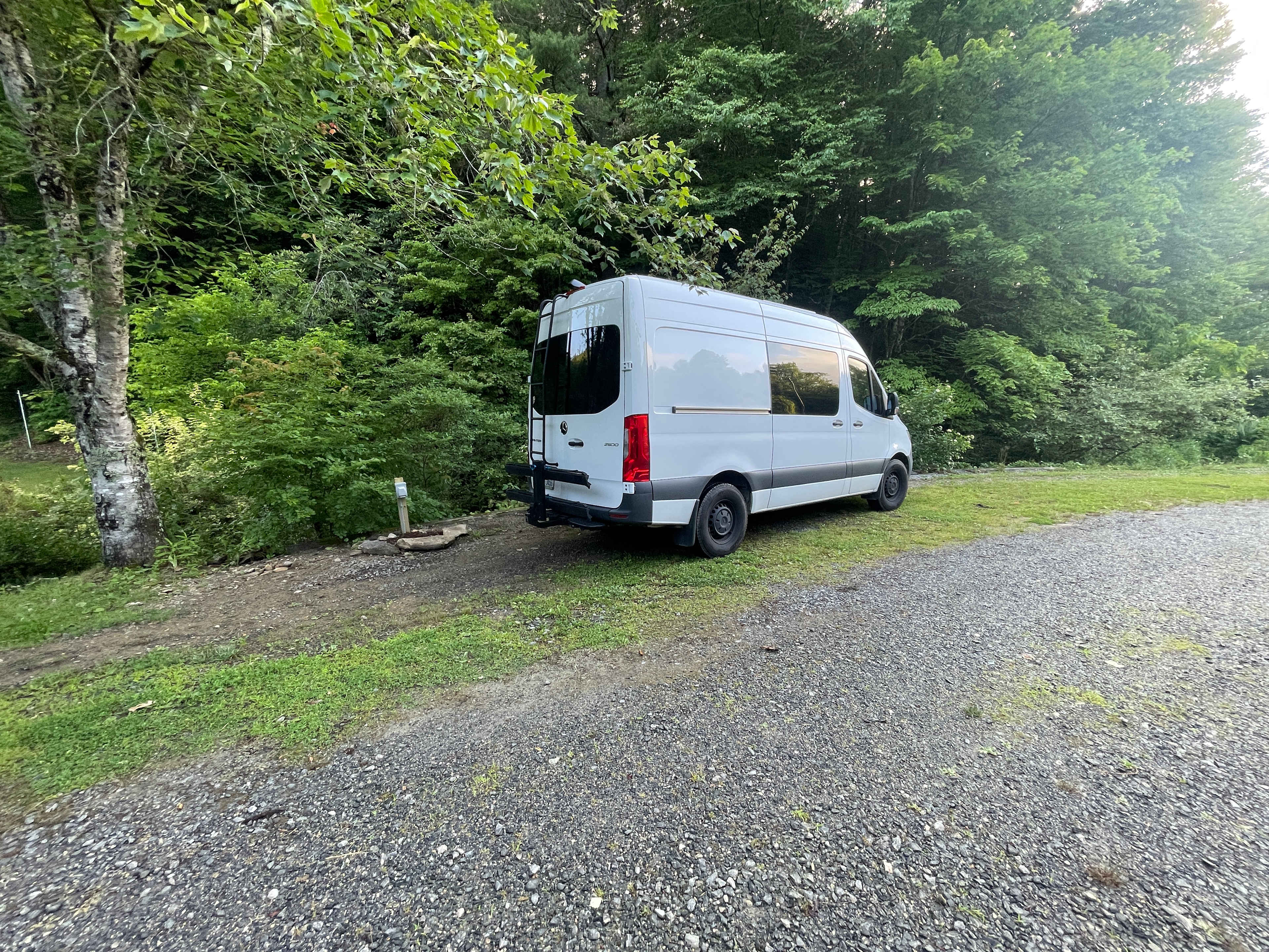 Creek on one side, driveway on the other and a few short steps tho the large back lawn.