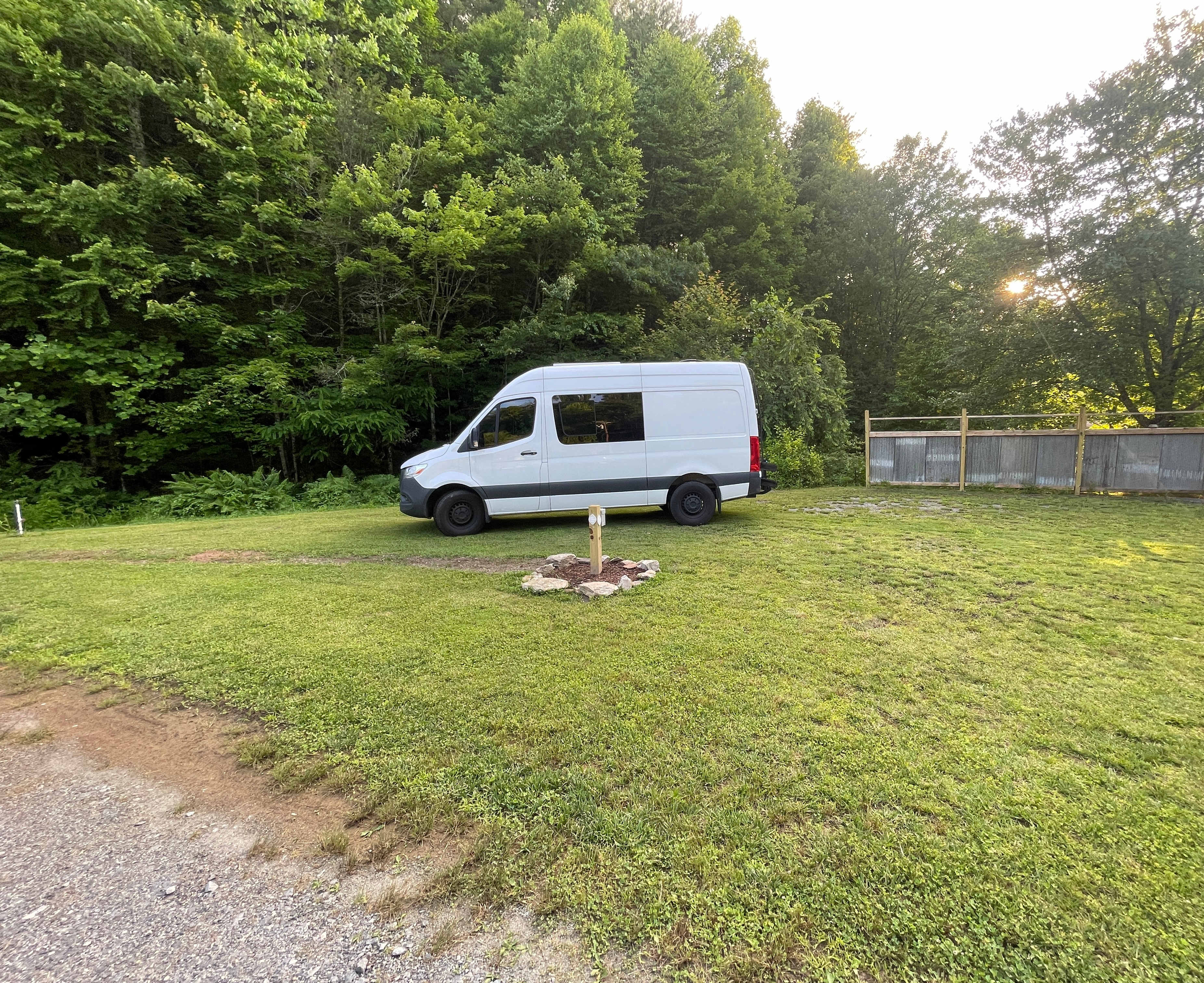 Spacious site, creek on one side and the driveway and dog yard on the other