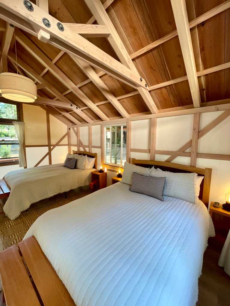 Cabin 6 has two luxurious queen beds with heated bed pads, cozy bedding, stunning woodwork, electricity and even a heater for the cold nights. 
