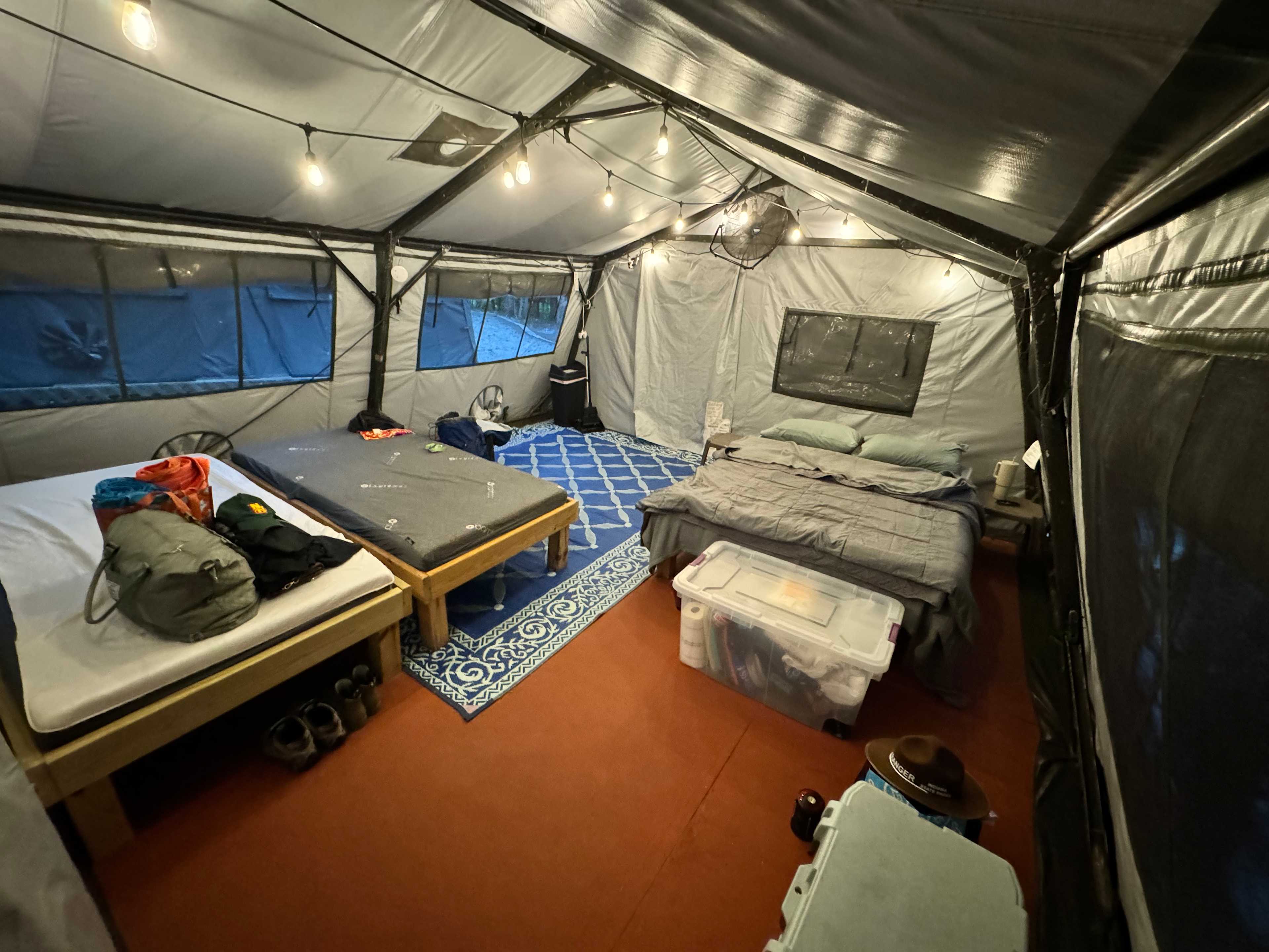 16x16 yurt, queen bed and two XL twin beds. Very spacious! Fan kept it cool with the window flaps open during the day! 