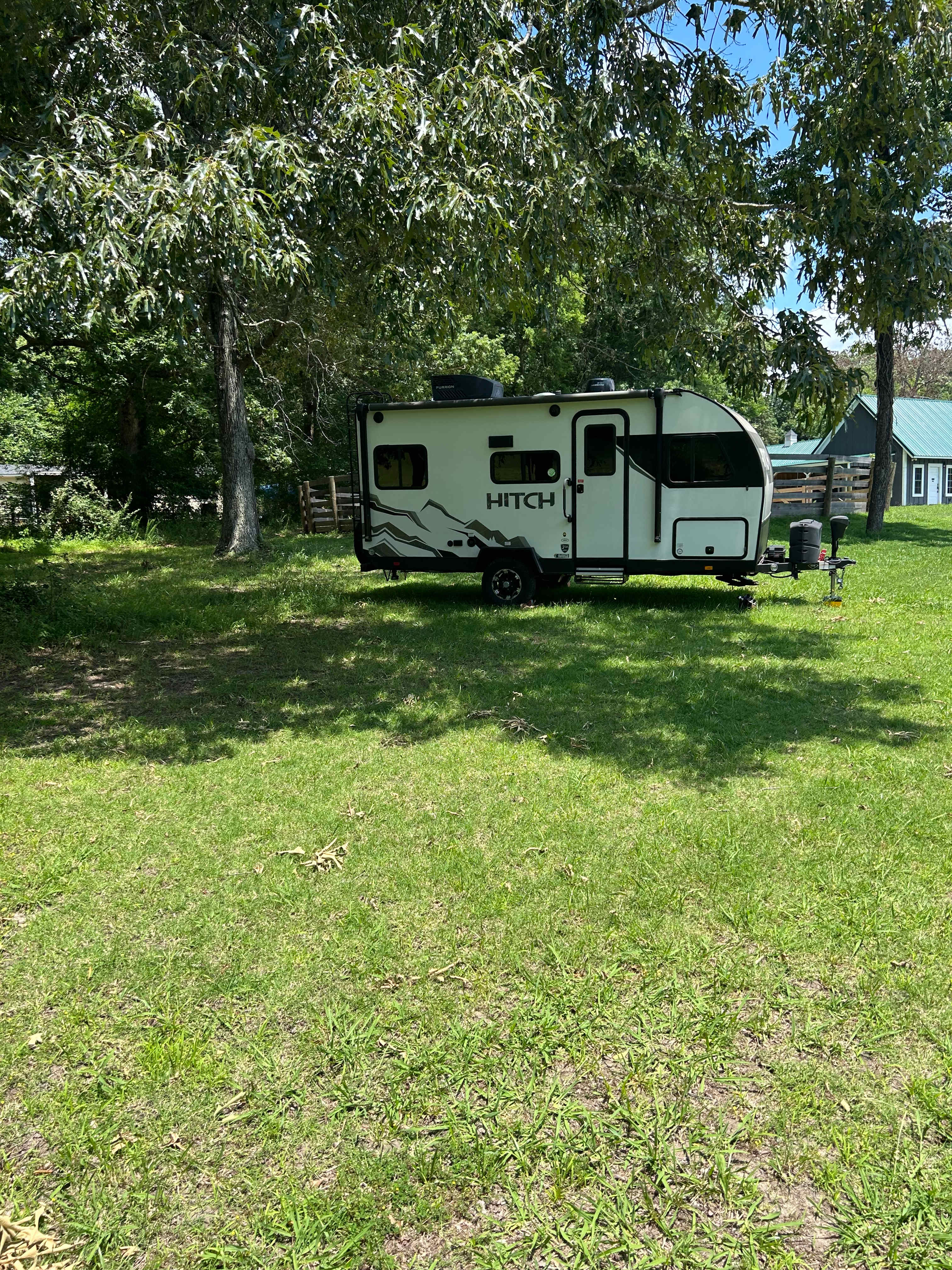 Rv spot with trees next to round pen for horse training