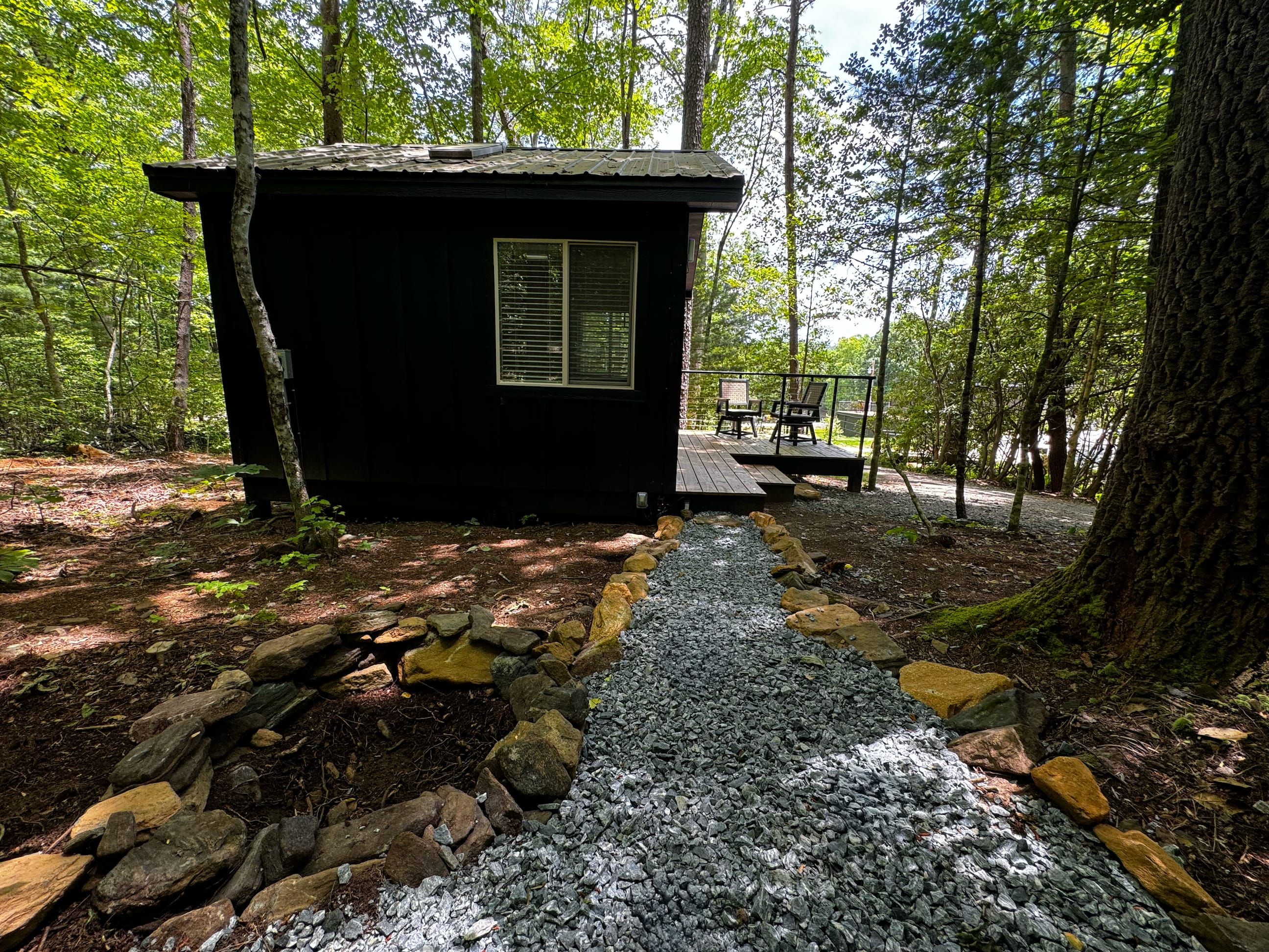 A side view of Lazy Bear 466 and its private porch and outdoor furniture.