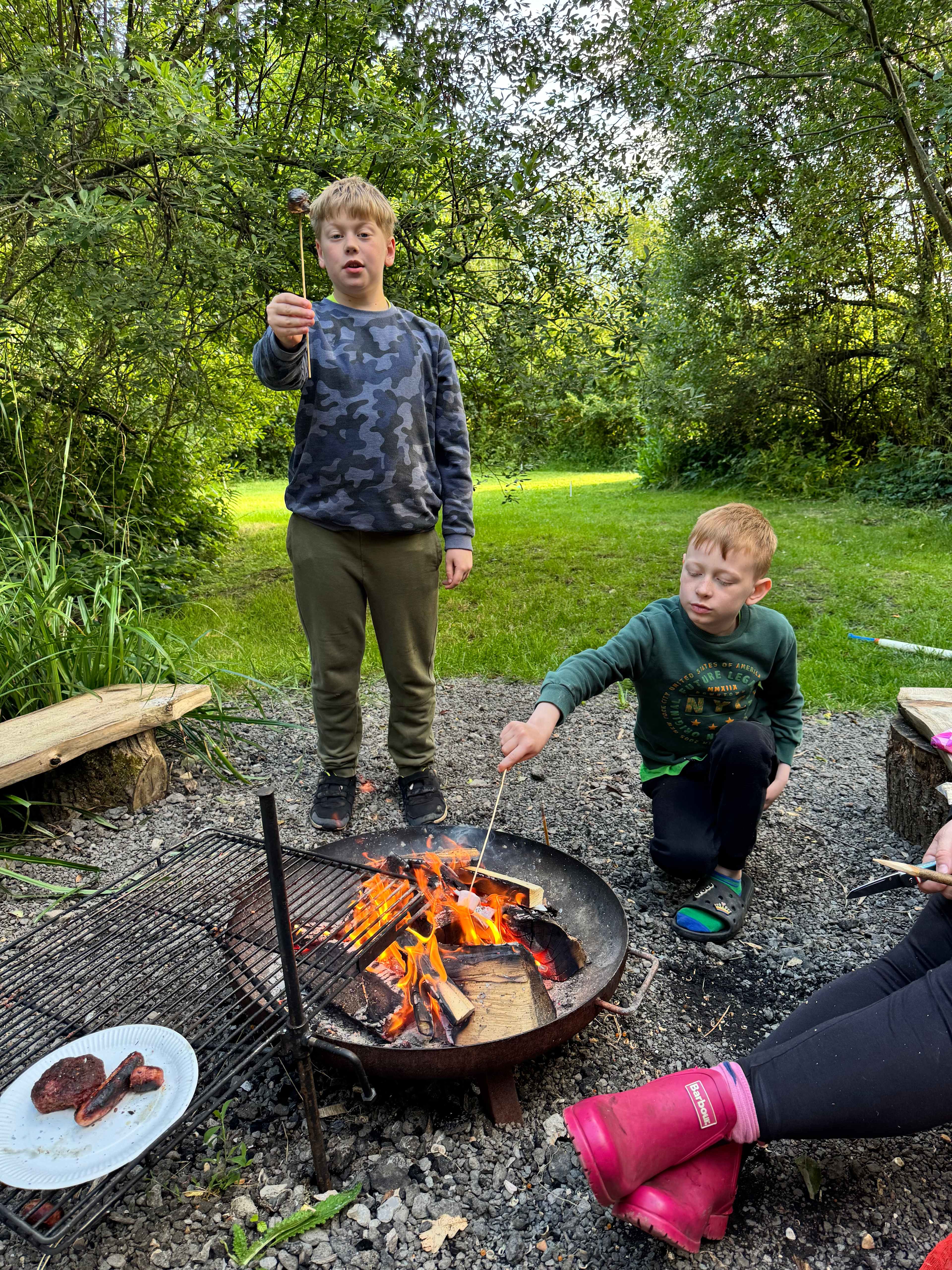 Kids enjoying toasting marshmallows