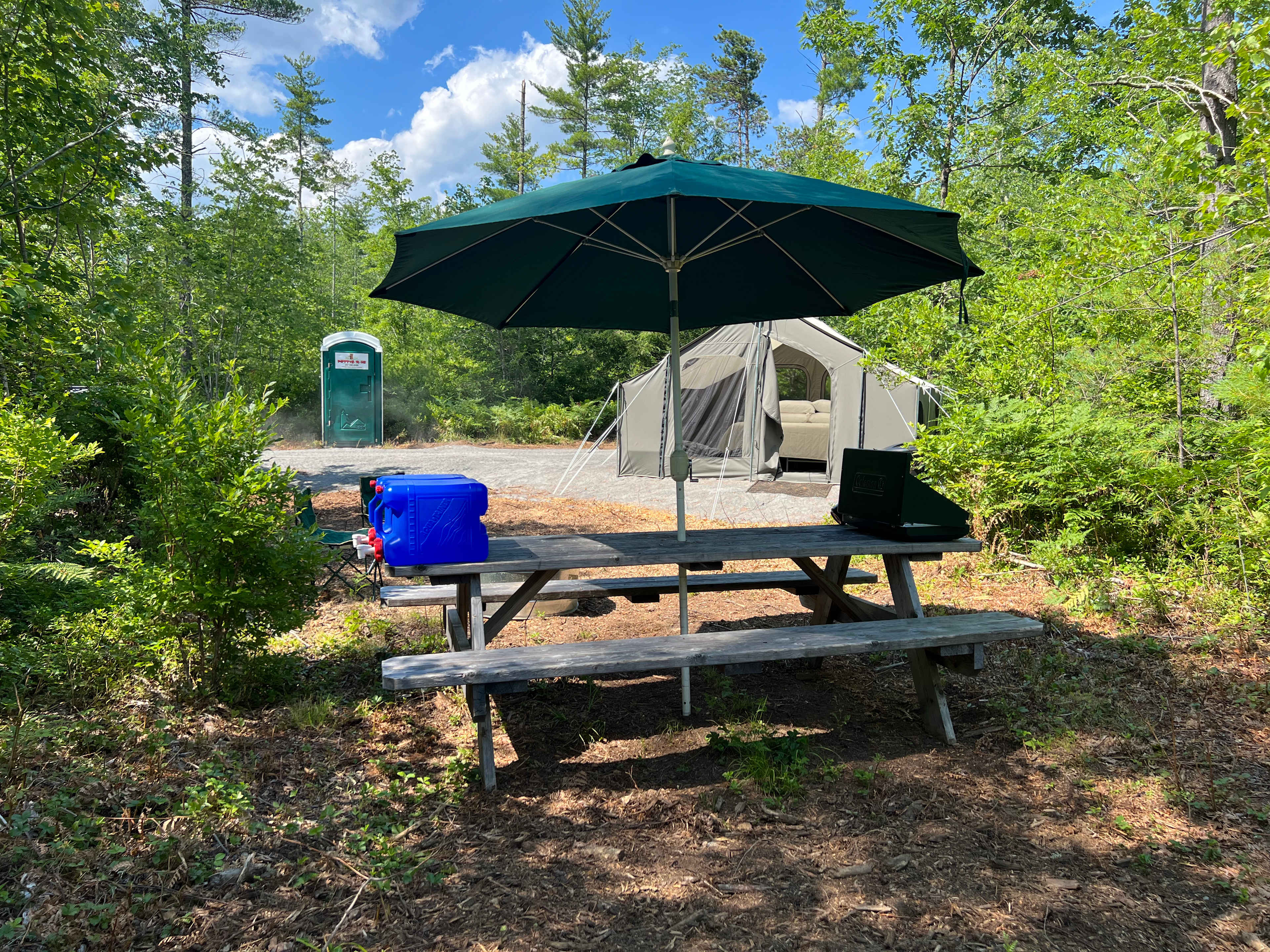 Rustic tent site with basic camping supplies; 12 x 12 tent with queen size bed, picnic table, propane stove, 15 gals water