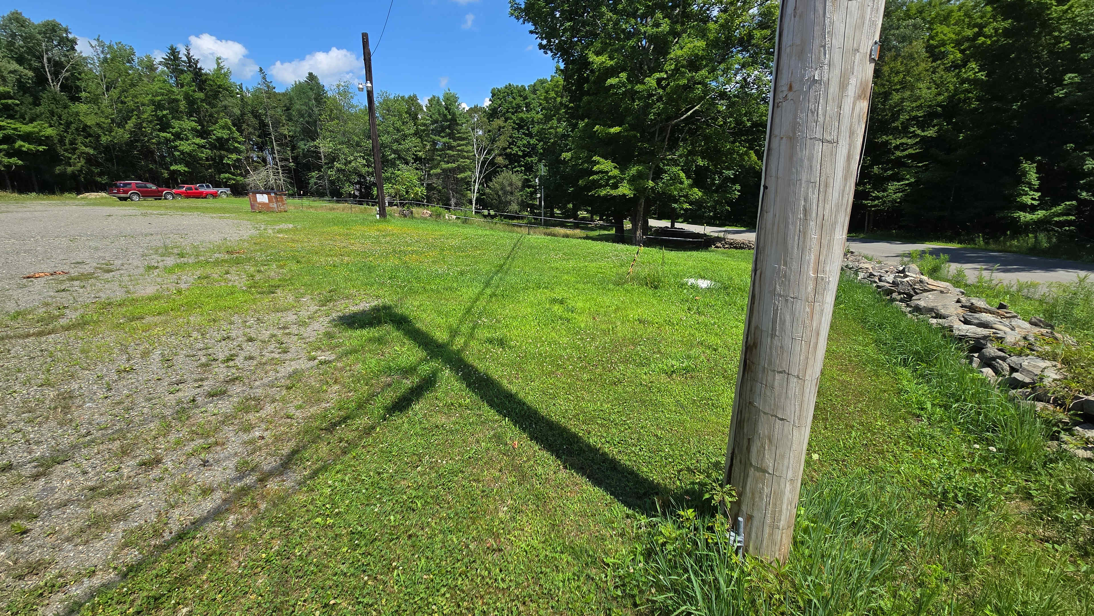 Gravel is pretty level, grass slopes off a bit. 