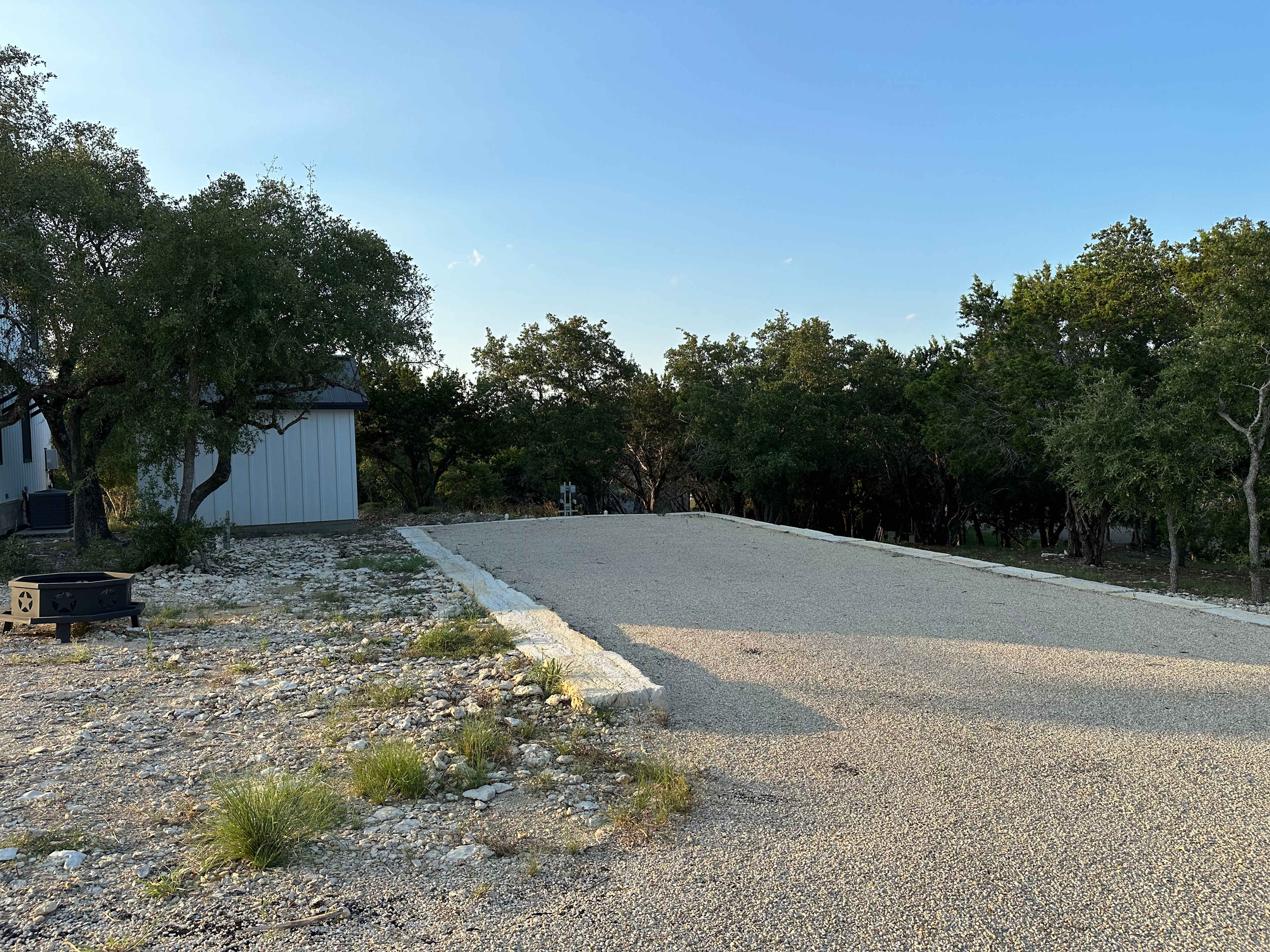 Site pad accommodates two RVs and is situated next to the fire pit for evening chats
