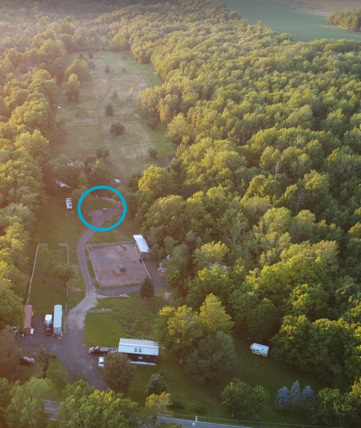 Overview of the top of the property - blue circle is the RV site, accessed by gravel driveway. The site is beside our peaceful babbling brook. Relax, and enjoy the sounds of nature! 