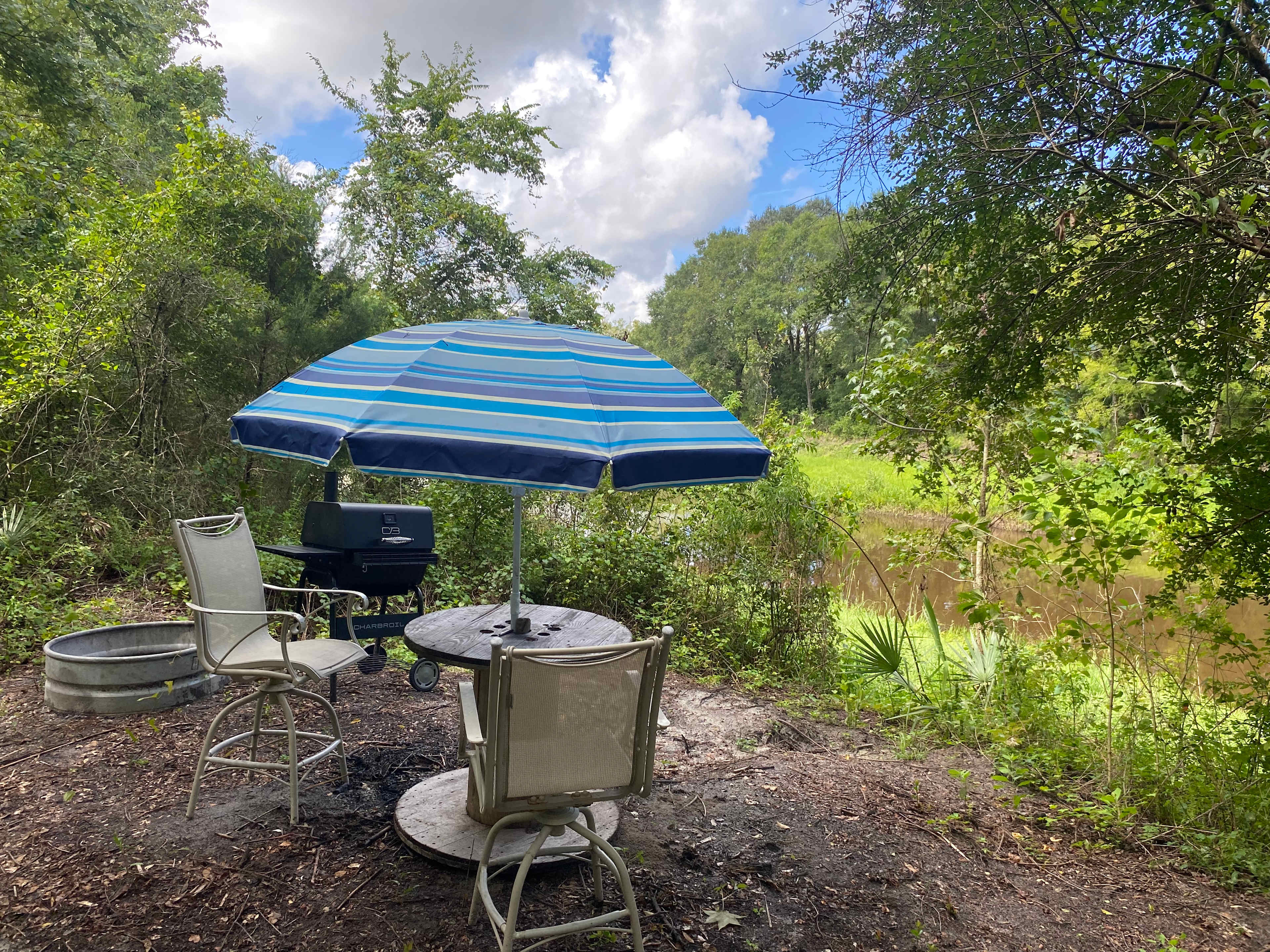 New Charcoal grill, fire pit ring and umbrella table available at this campsite.