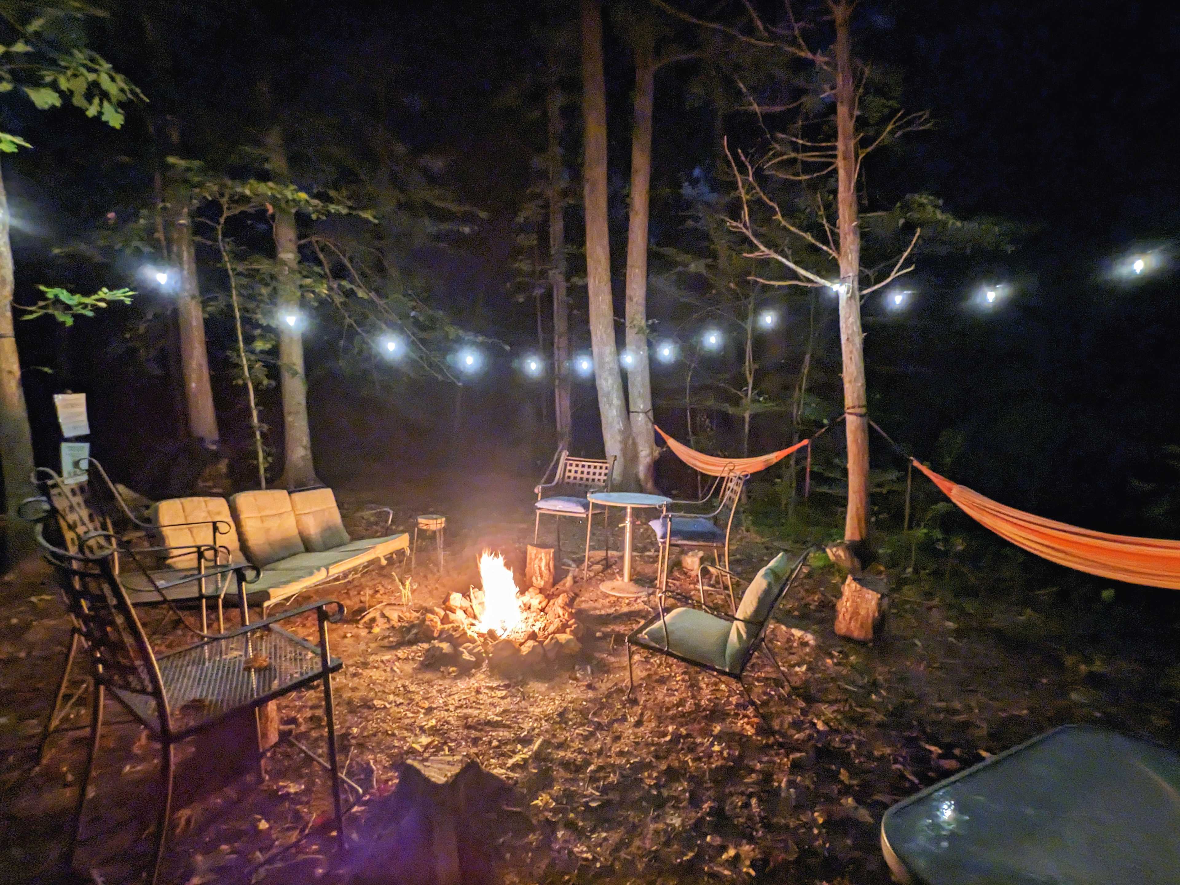 All that you see is included! Plenty of comfortable seating, two hammocks, firewood at the site (purchase on the honor system), propane grill (propane included), and solar powered string lights.