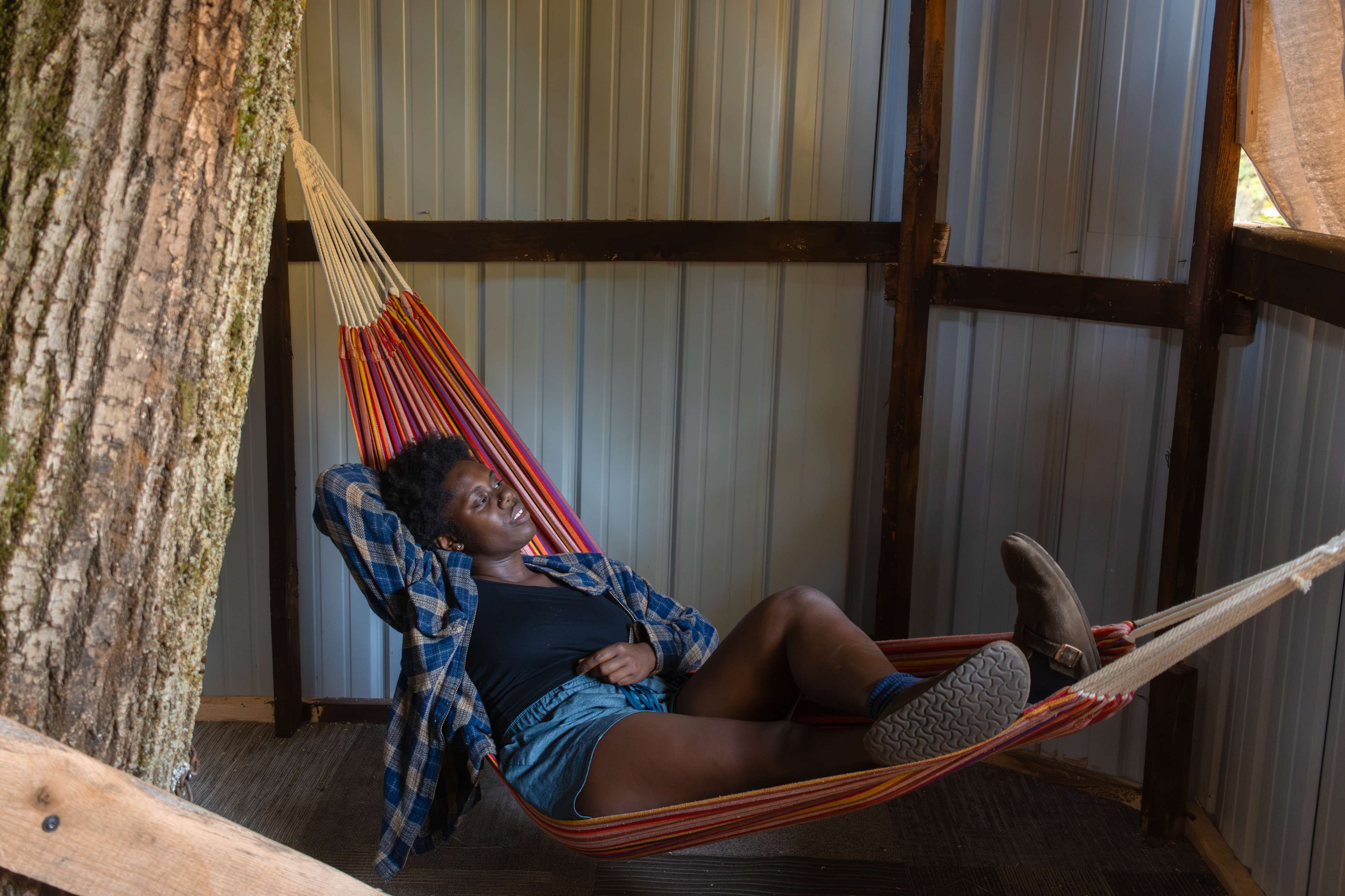 Lounging in one of three hammocks in the treehouse.
