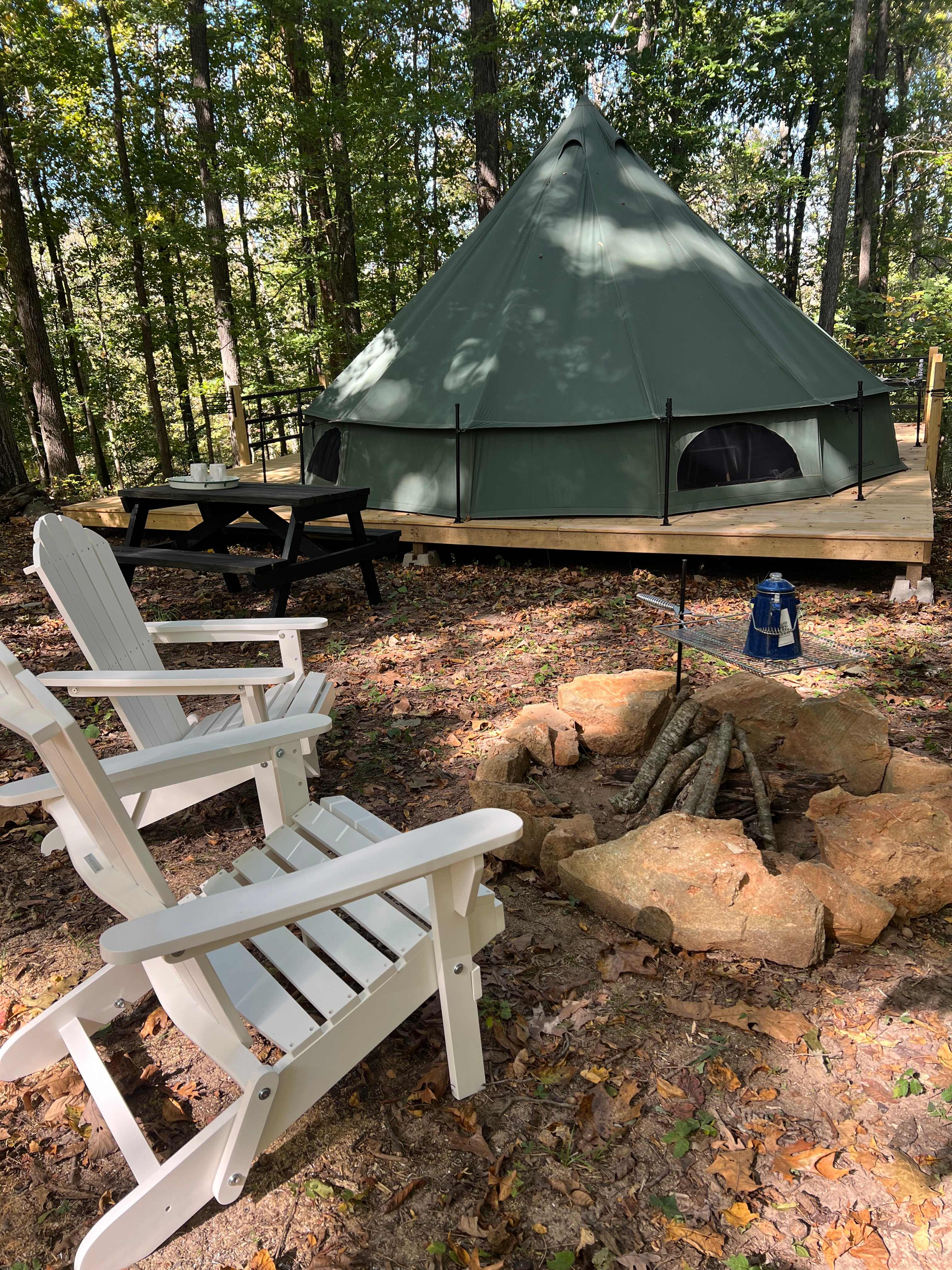 Our Hazel Tent Site is a drive up site that includes a picnic table, fire-pit with grill rack and chairs to sit and enjoy the view from.