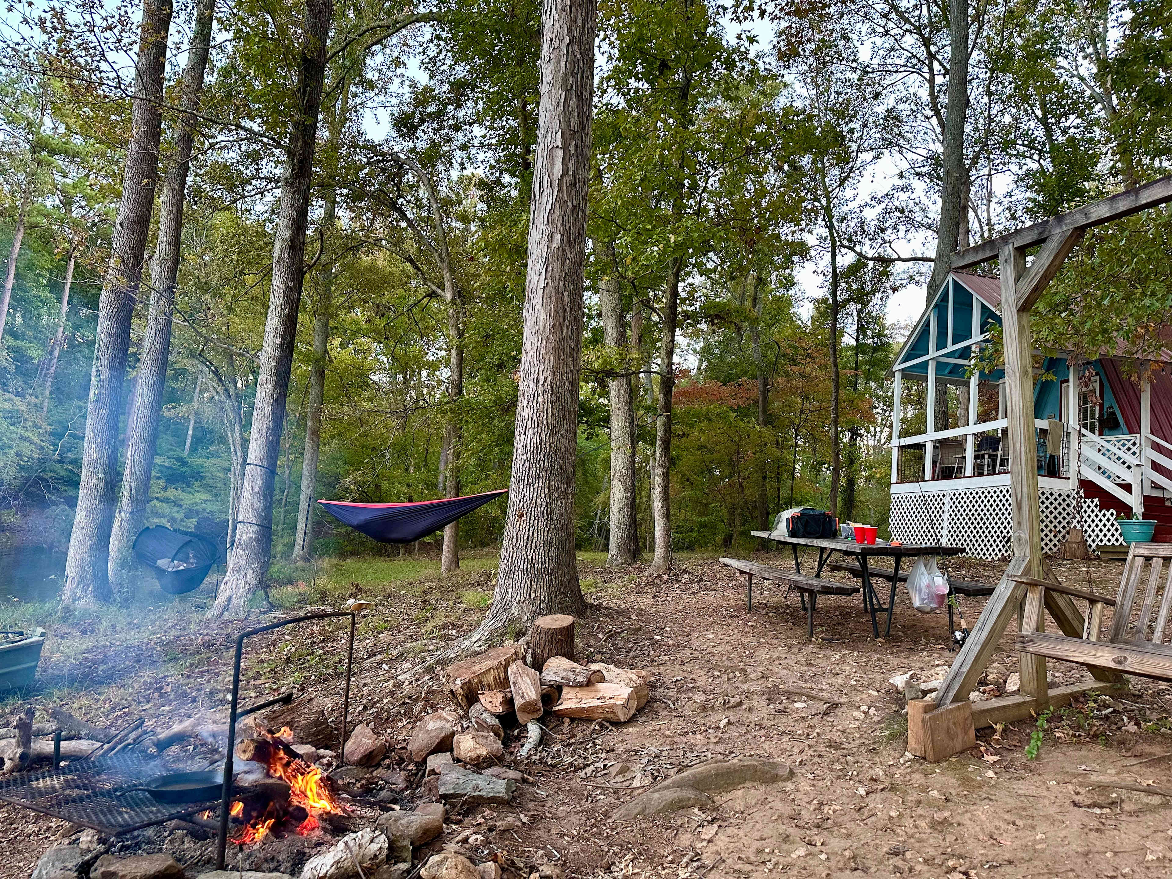 Hammocks for the teens, tieouts for the dogs, & a comfy porch for mom, & a campfire for ALL 🫶🏼