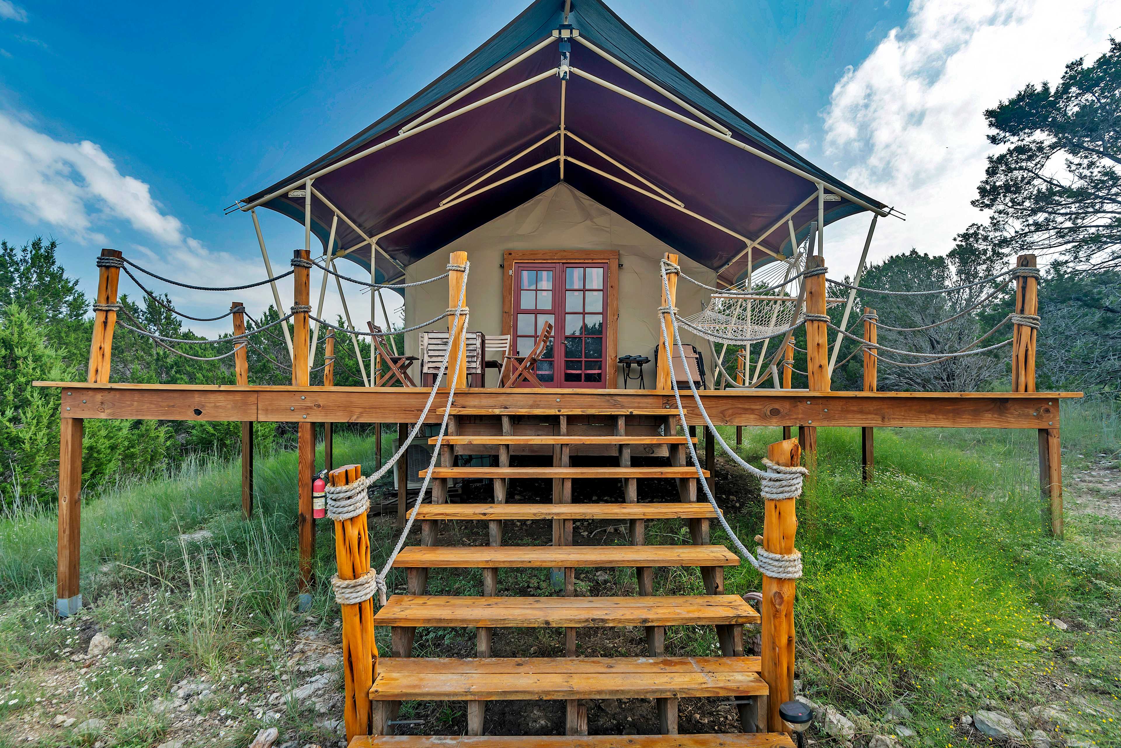 Step into a fully insulated permanent tent with AC & heat, raised 6 ft above the ground, nestled in an exotic animal refuge. This unique retreat lets you unplug, unwind, and immerse yourself in peaceful nature —all without sacrificing comfort!