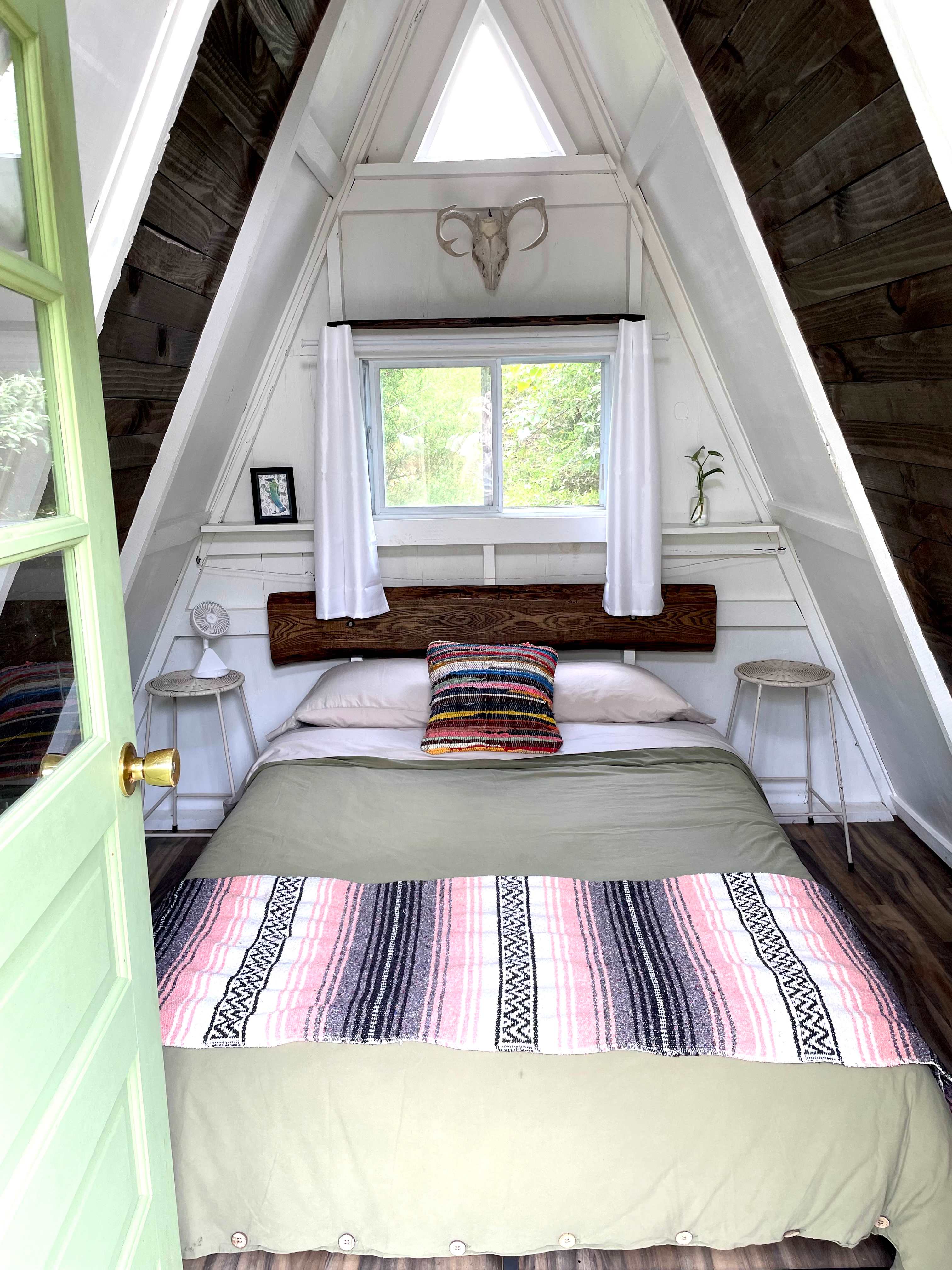 This cozy a-frame cabin has a full-sized bed with a comfy memory foam mattress.  Clean bedding provided.