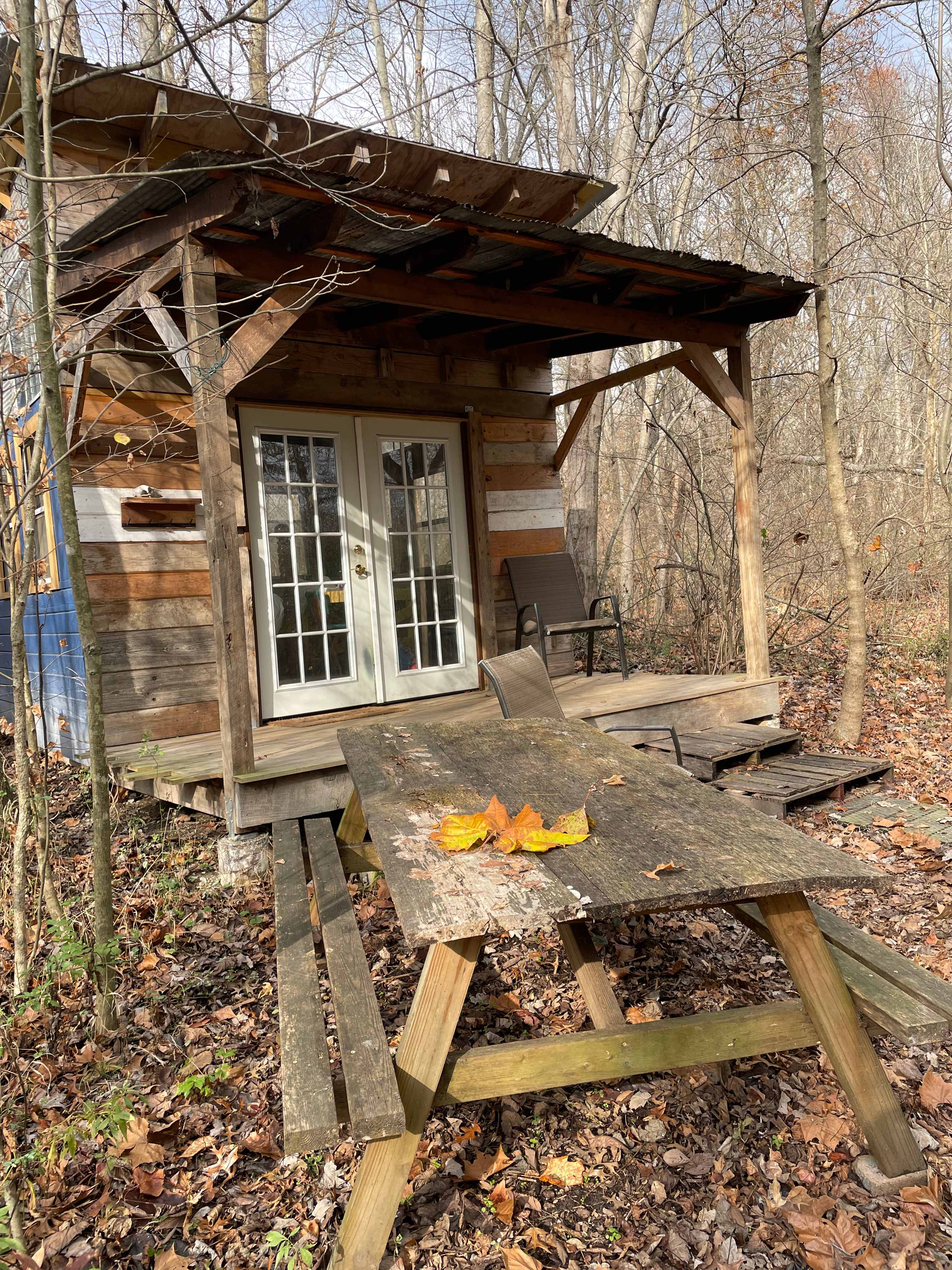 Cabin and picnic table (fire pit just out of view)