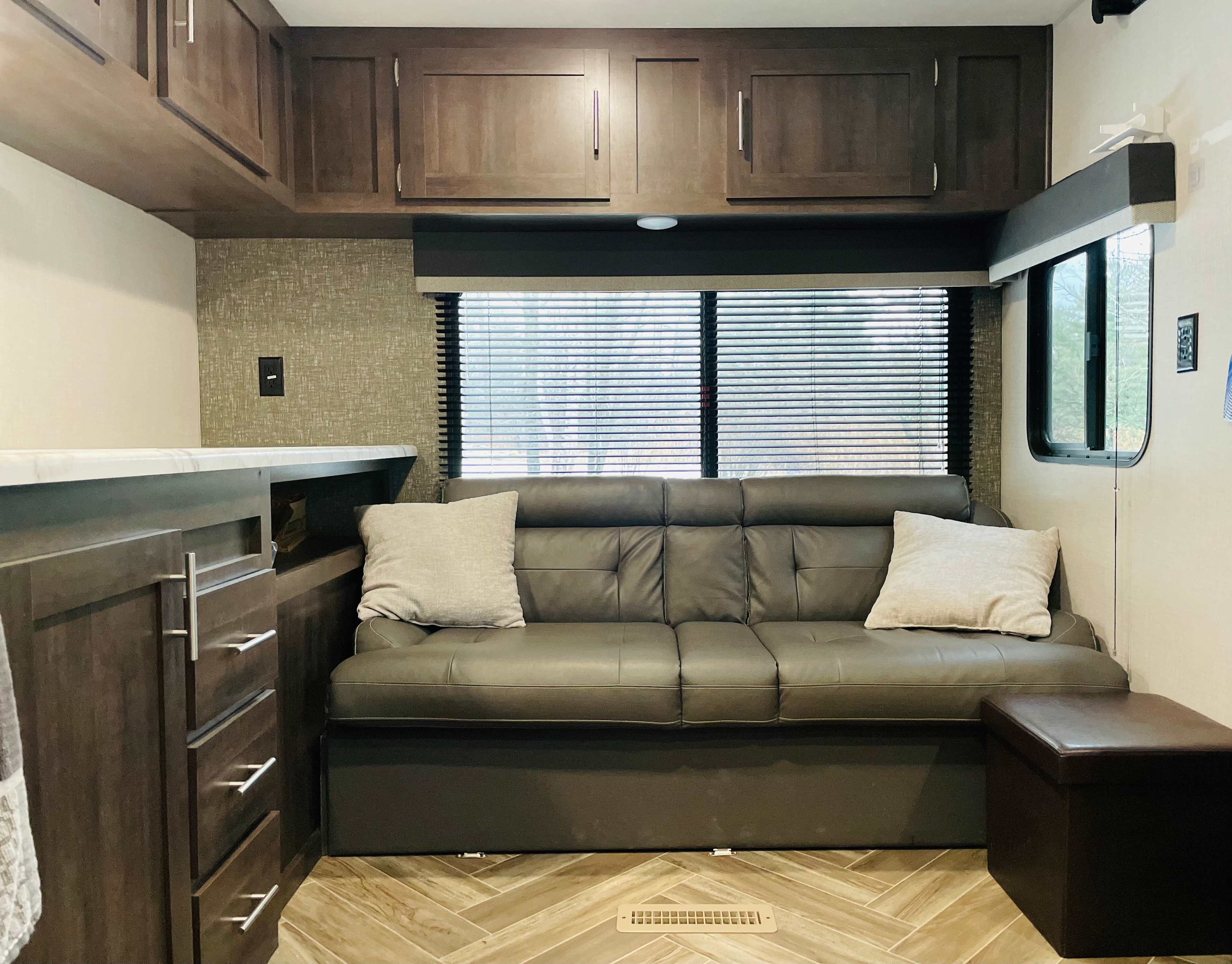 Couch turns into a bed (full size)
Clean linens/blankets and pillows available. 