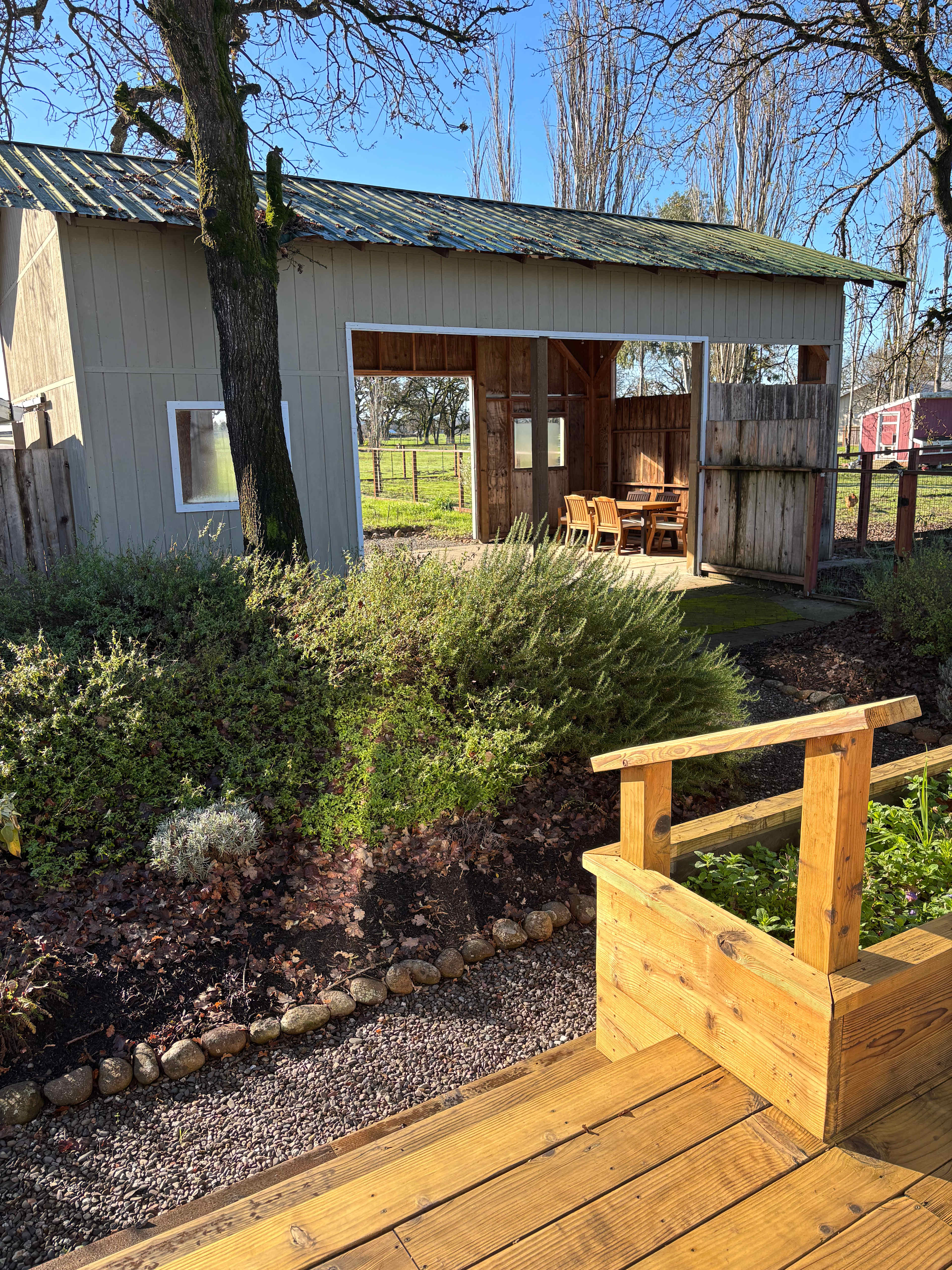 The view of the barn and herb garden from the main porch. 