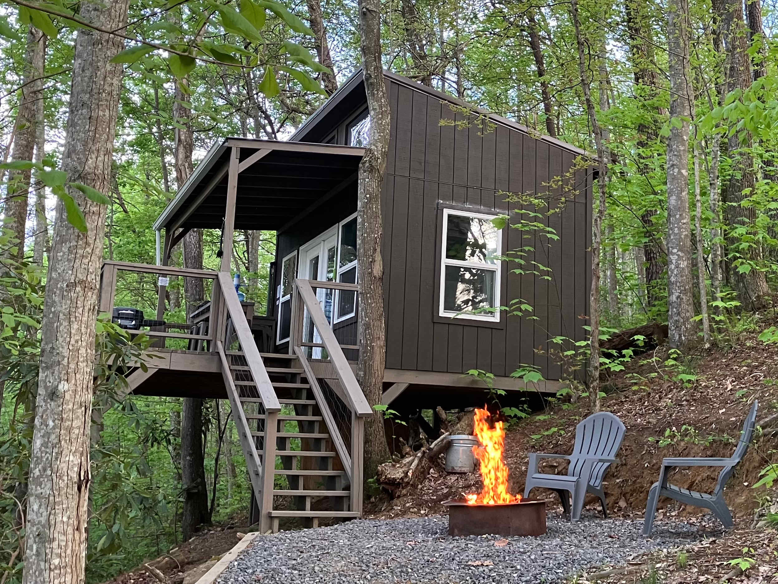 Relax and unwind around the fire at Treehouse #1