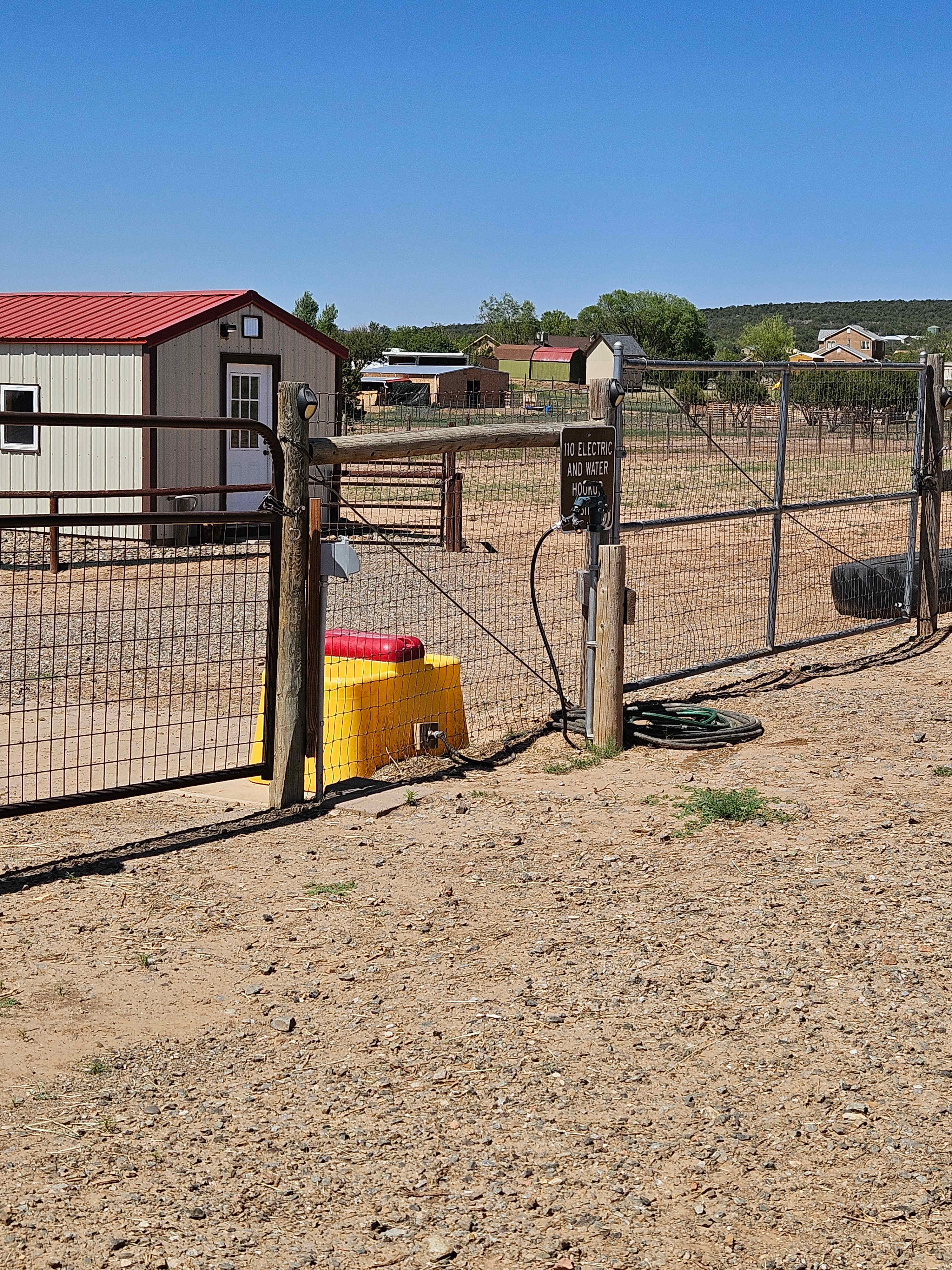 110 electric and water hookup. If you are traveling with horses, mules etc there is a Ritchey automatic waterer and a matted shelter within the 100 ft X 200 ft pen.