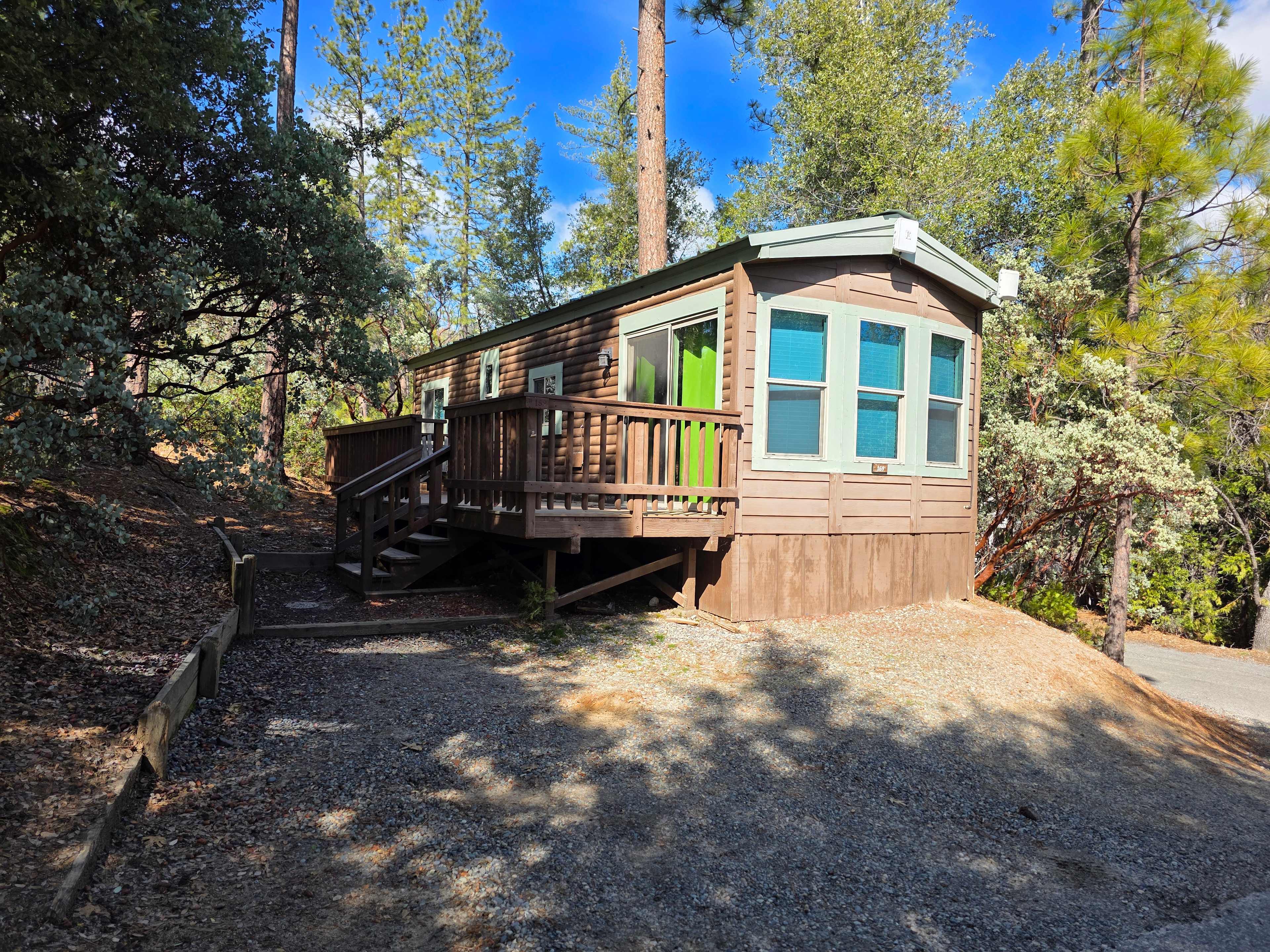 Our rustic log cabins come with private patios and 2 x chairs