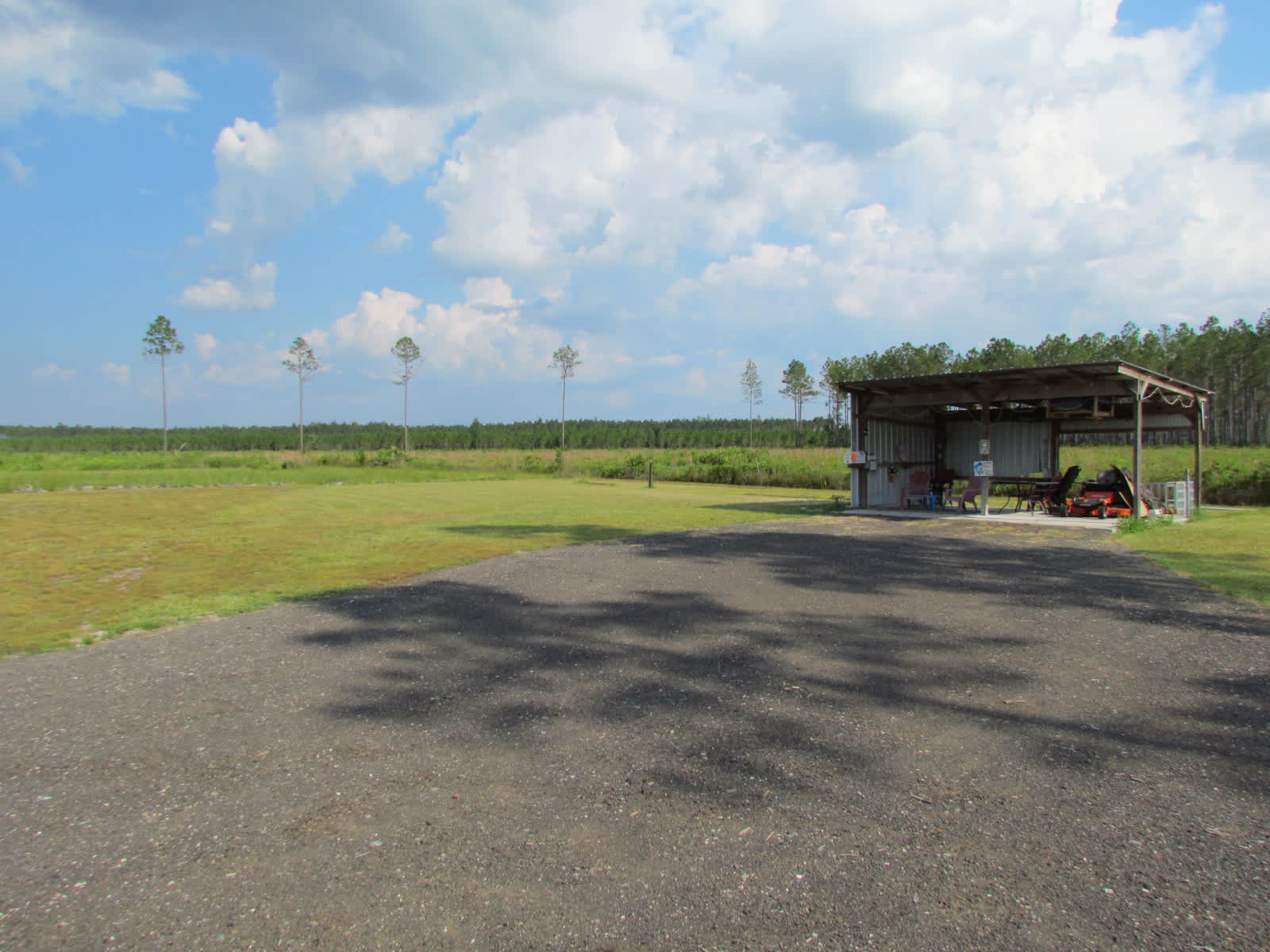 This is the shed area where the 30 amp is located as well as water. A community area w. a table and chairs.
