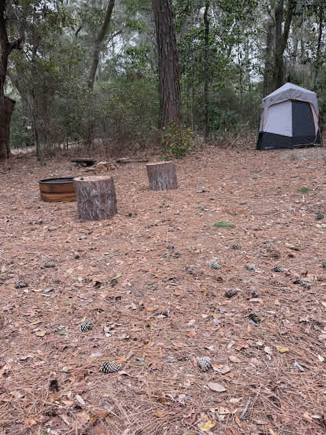 Campfire area and toilet/shower tent. 