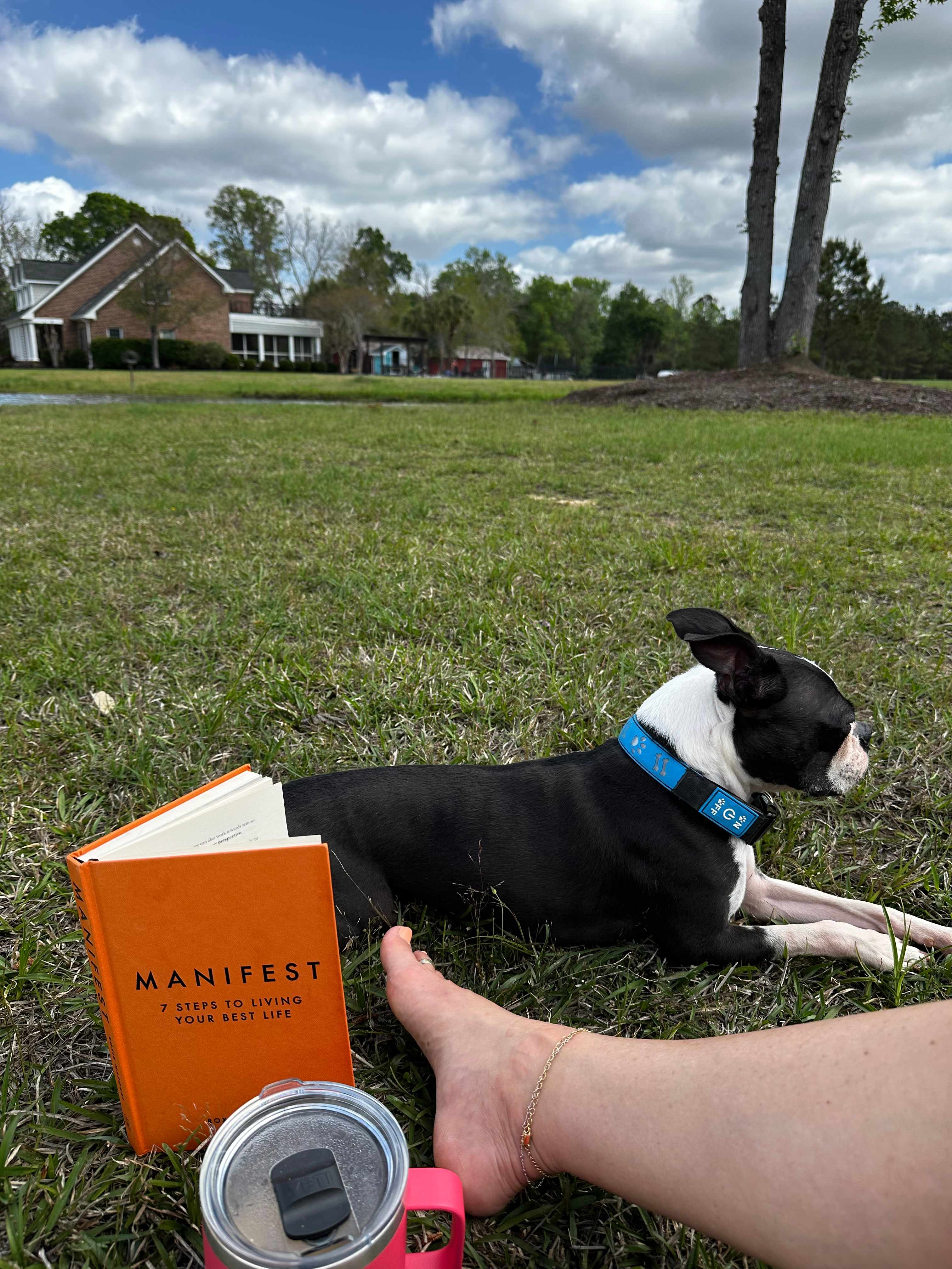 Turbo and I reading and relaxing while the guy fishes 