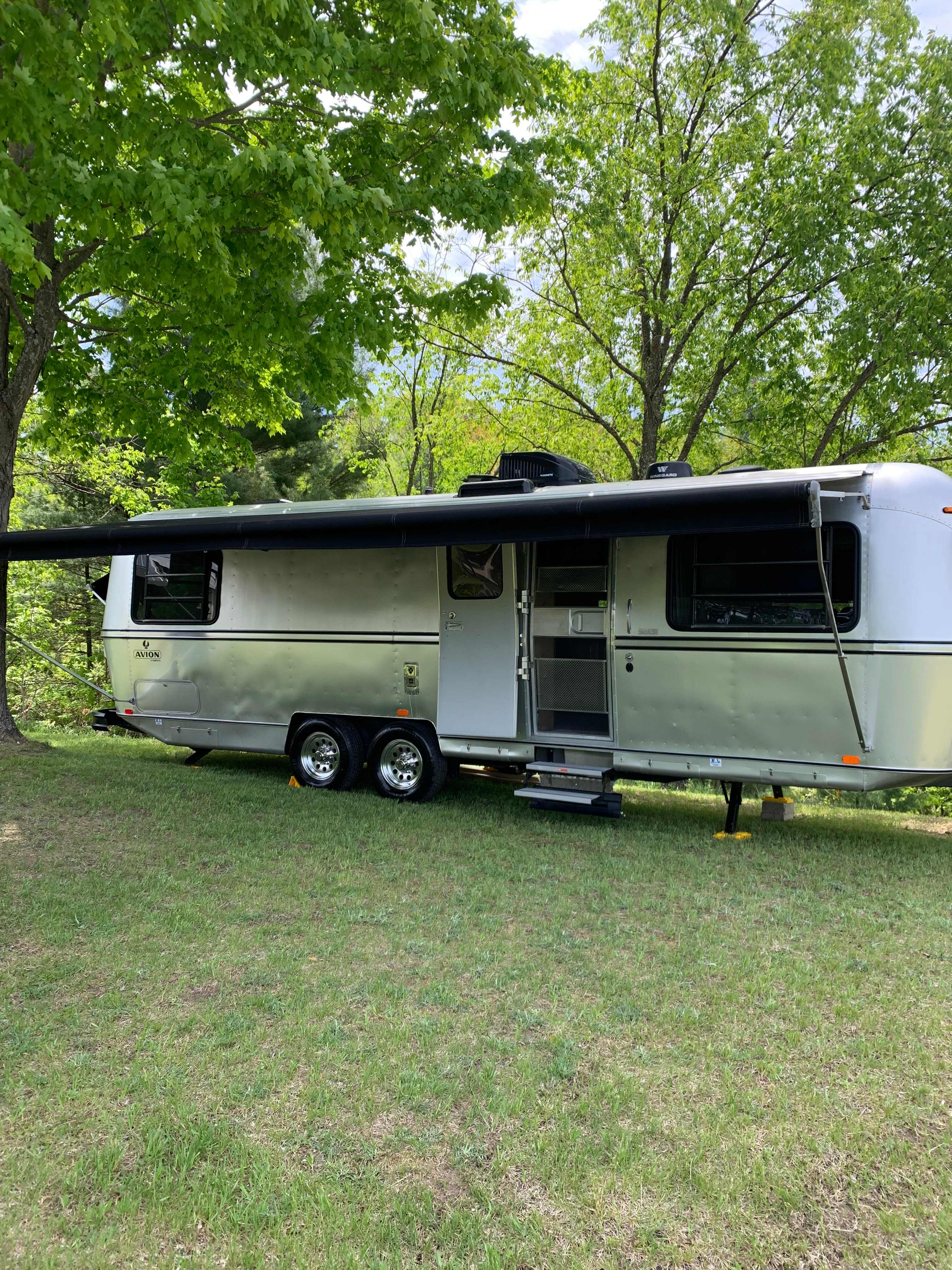 Avion on site with main awning