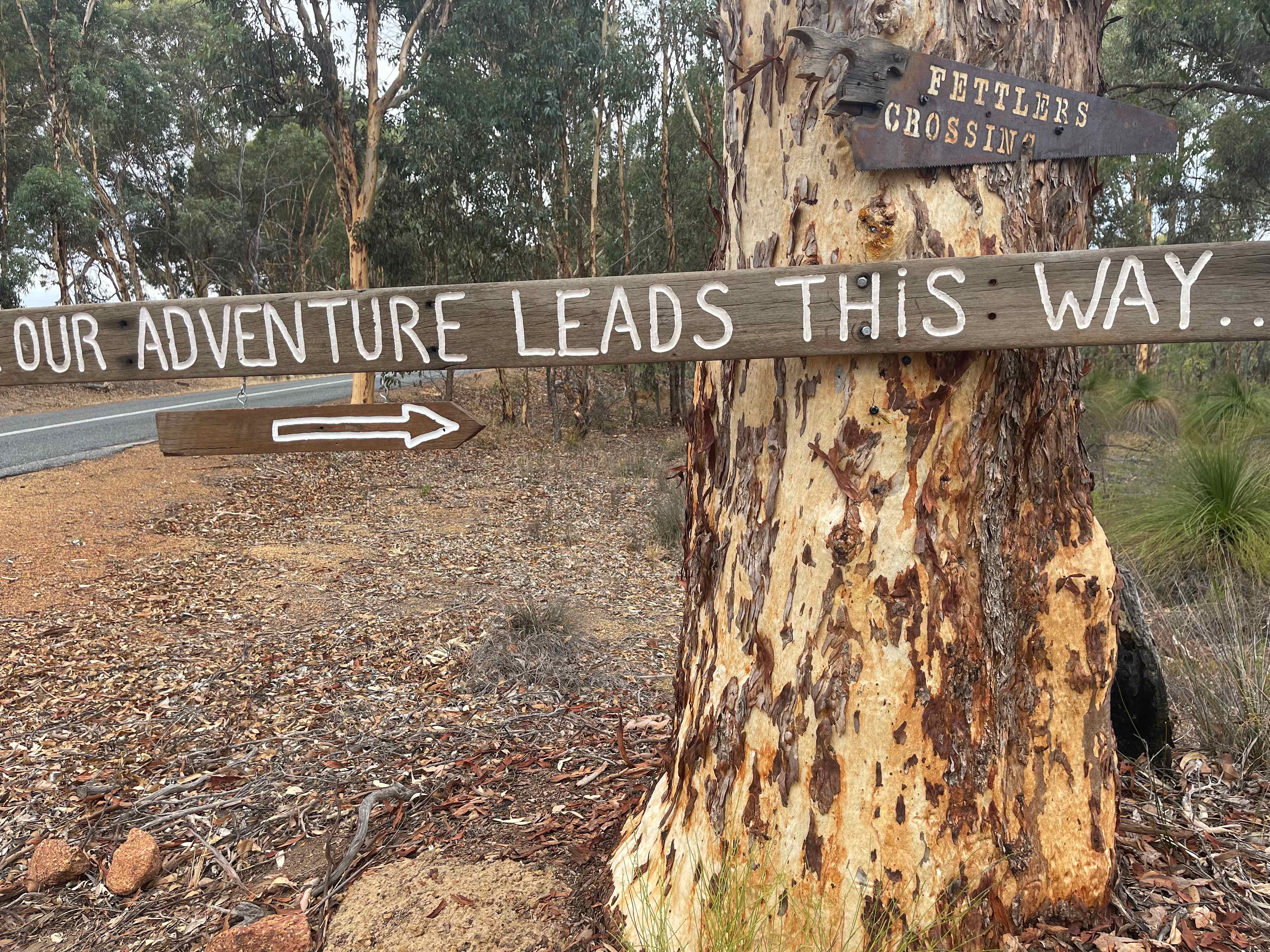 This sign leads to the Hipcamp sign down the track 