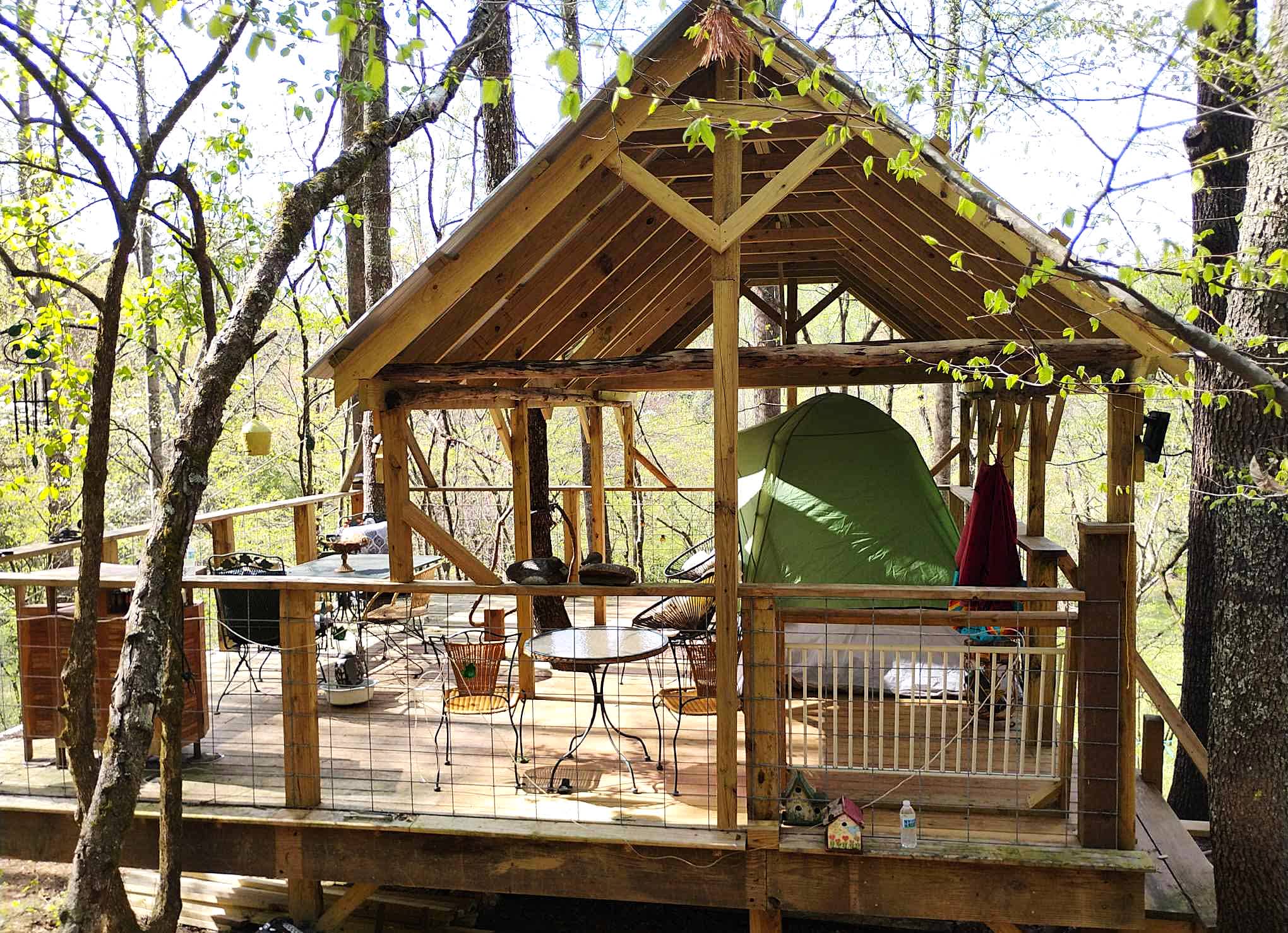 Another view of the Bird's Nest 20'x 20' ft. There is plenty of room for your tent under this partial shelter. This photo has a 6 person tent (144in X 102in X 72 in) underneath the roof with plenty of room to spare. 