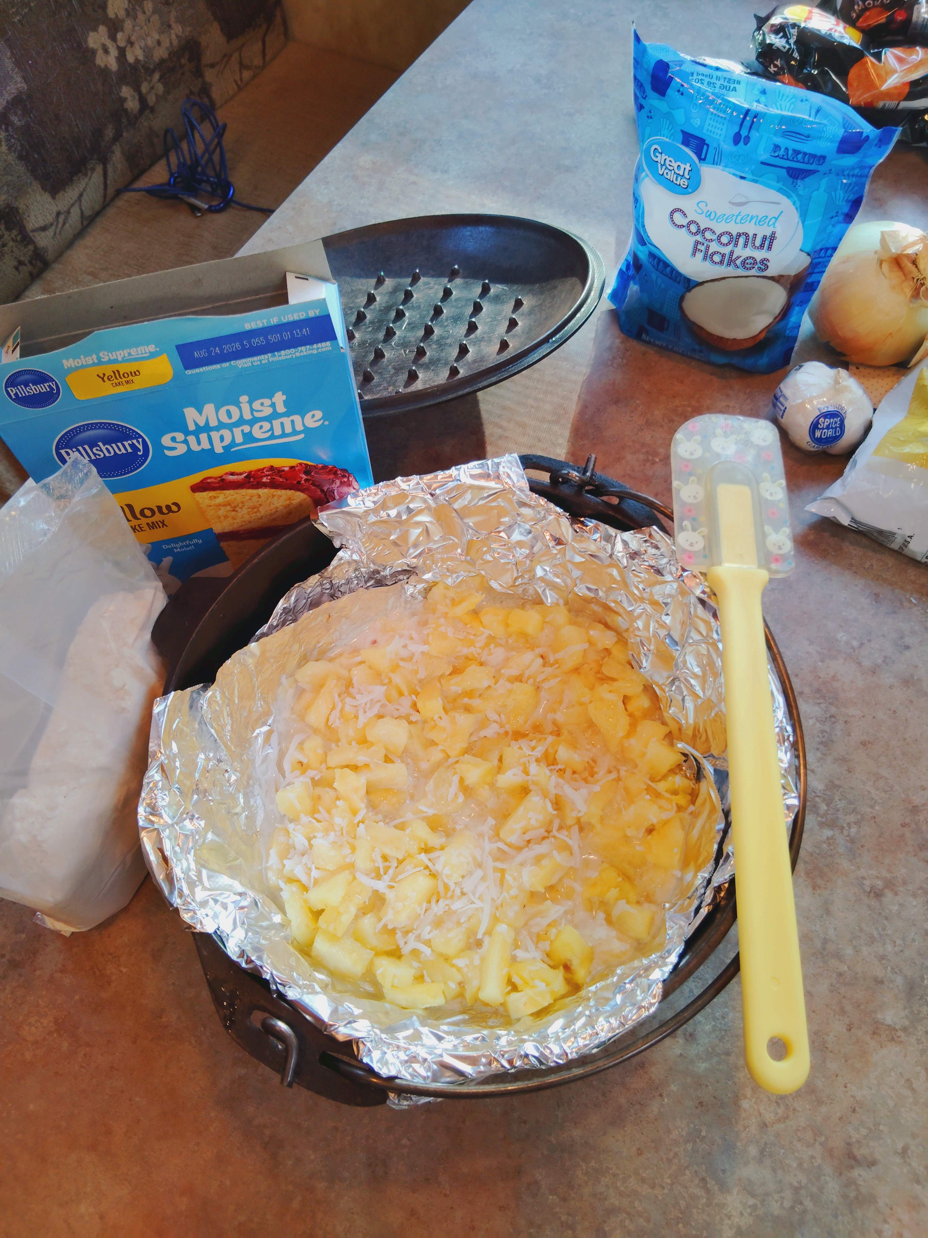 Preparing Pineapple Dump cake in Dutch oven. 