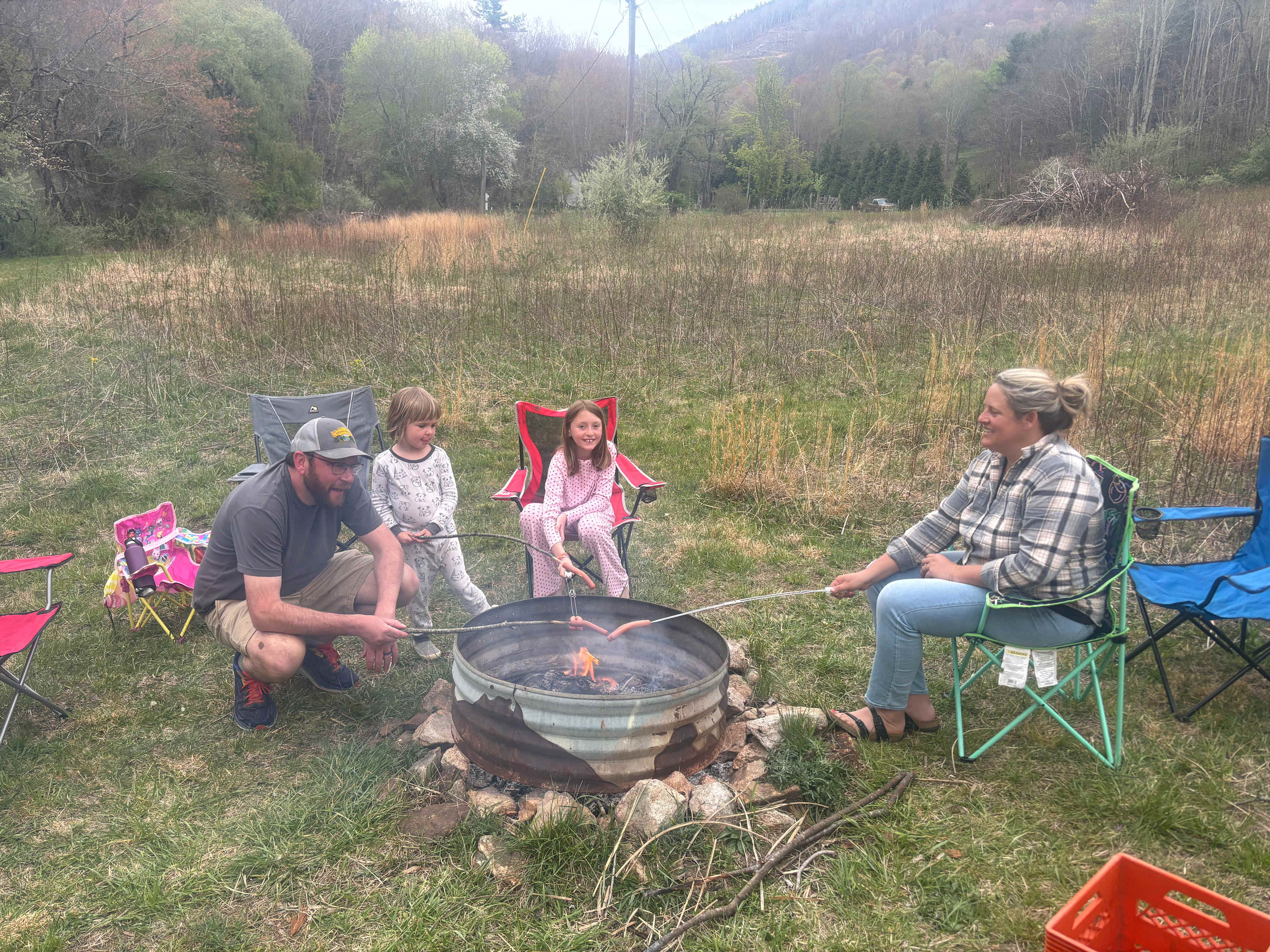 Roasting hot dogs over the campfire!
