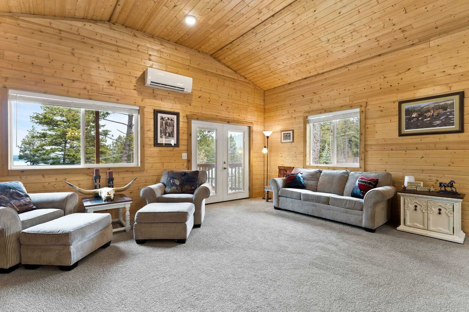 The open floor plan and 12' vaulted ceilings, gives the interior a larger feel than from the exterior. The Minisplit Heat Pumps keep it comfortable. 