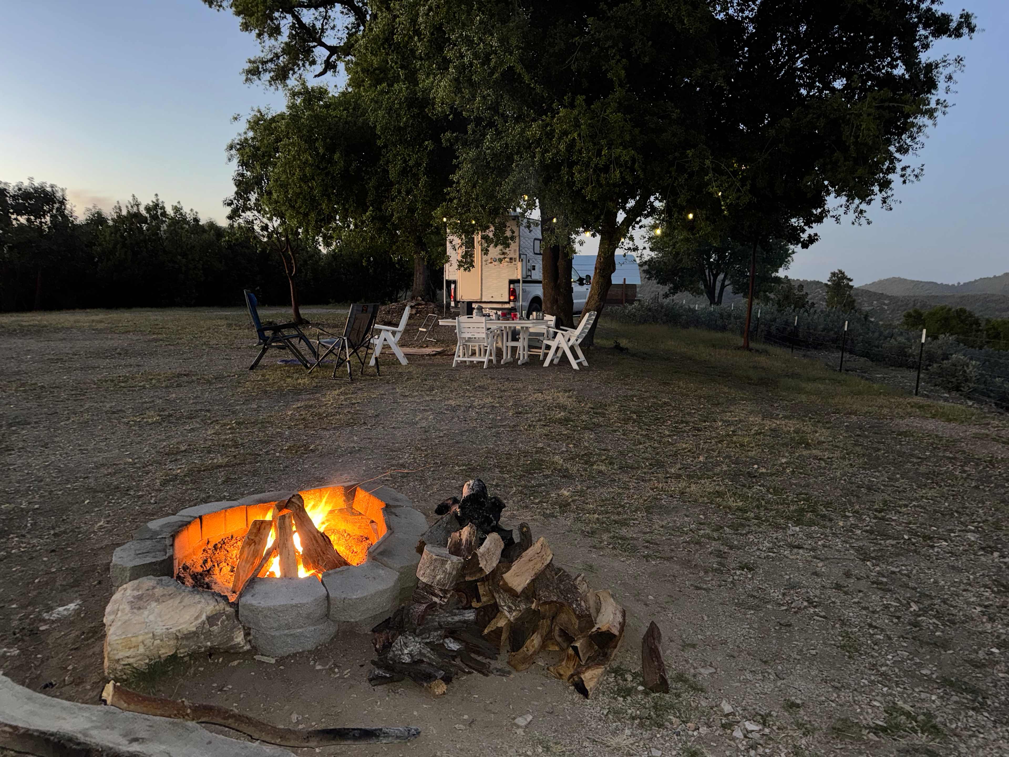 Nice oak for shade with table. Be campfire safe as winds can come up!