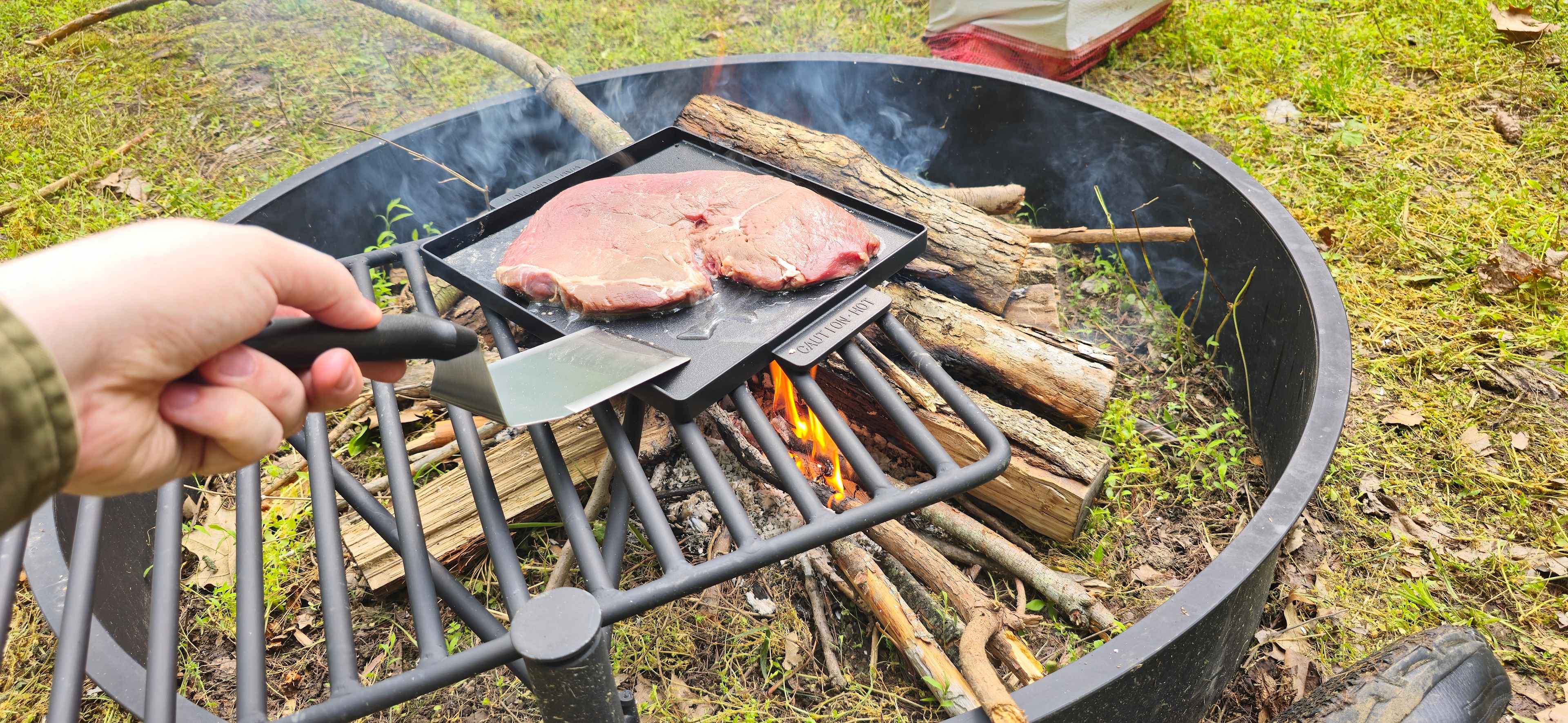 Cooking Steak over the campfire.