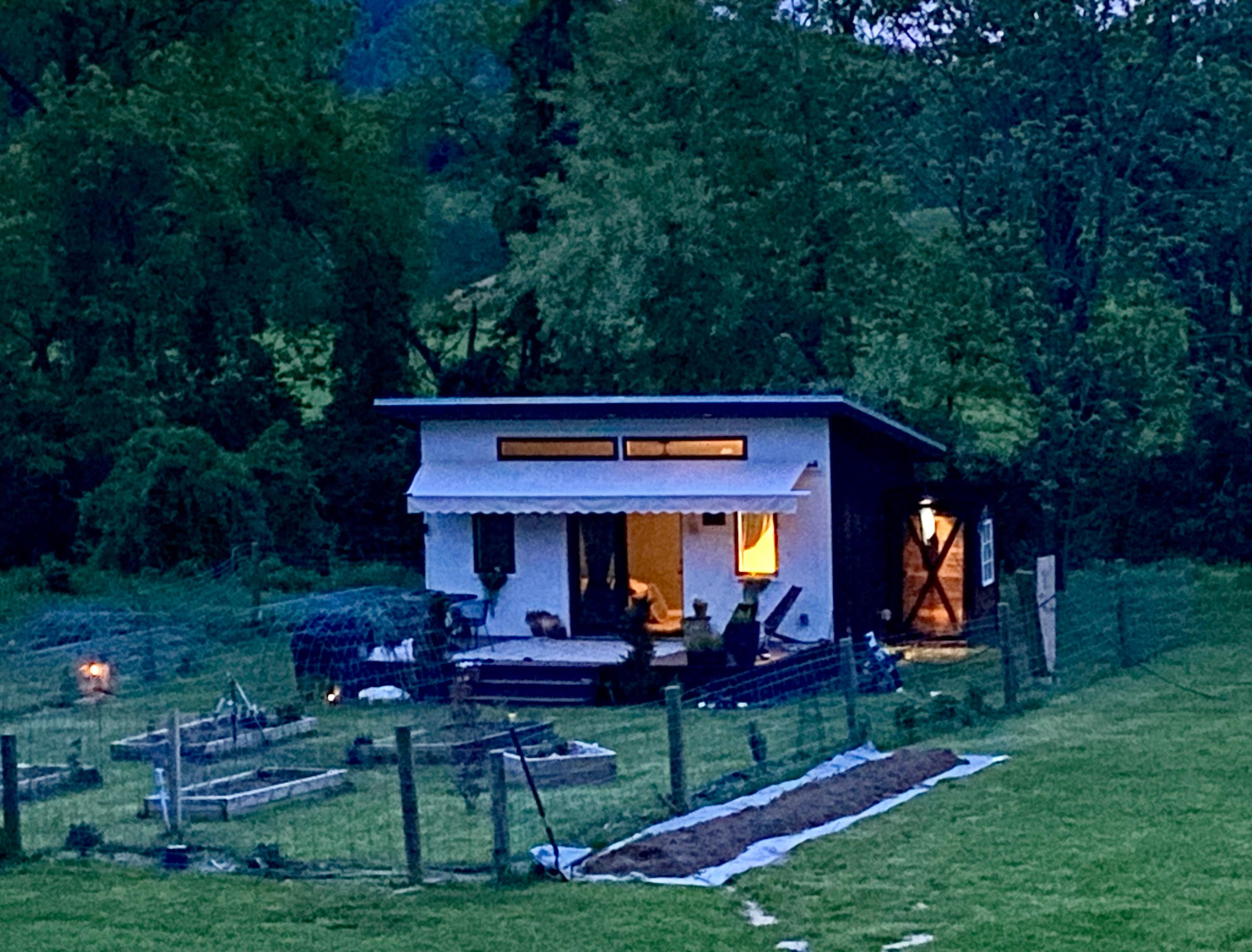 12x20 building (240 sqft) of space with mini-split and Starlink internet, refrigerator, coffee, grill, and smokeless fire pit. 